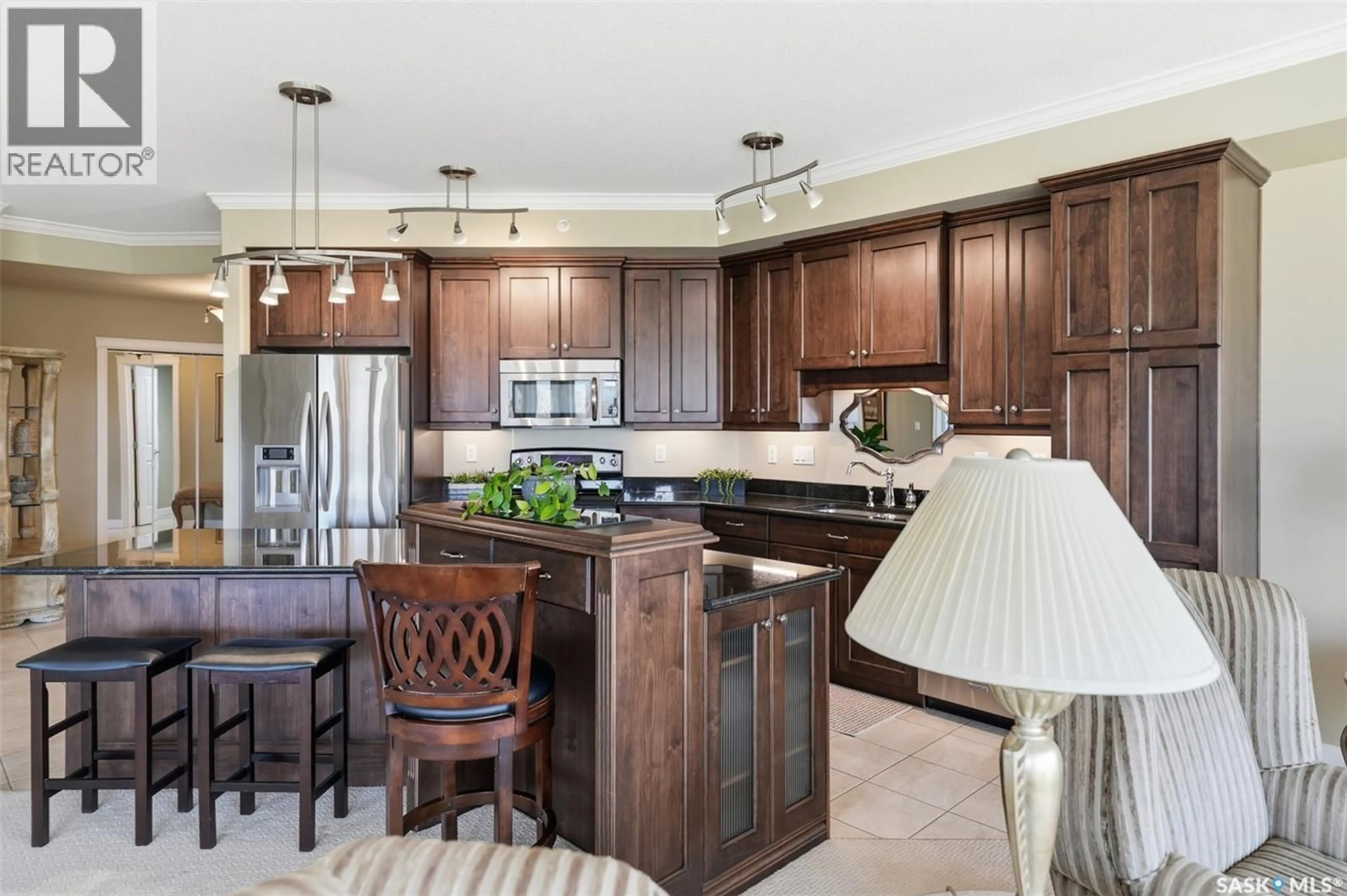 Open concept kitchen, ceramic/tile floor for 402 - 405 CARTWRIGHT STREET, Saskatoon Saskatchewan S7T0C8