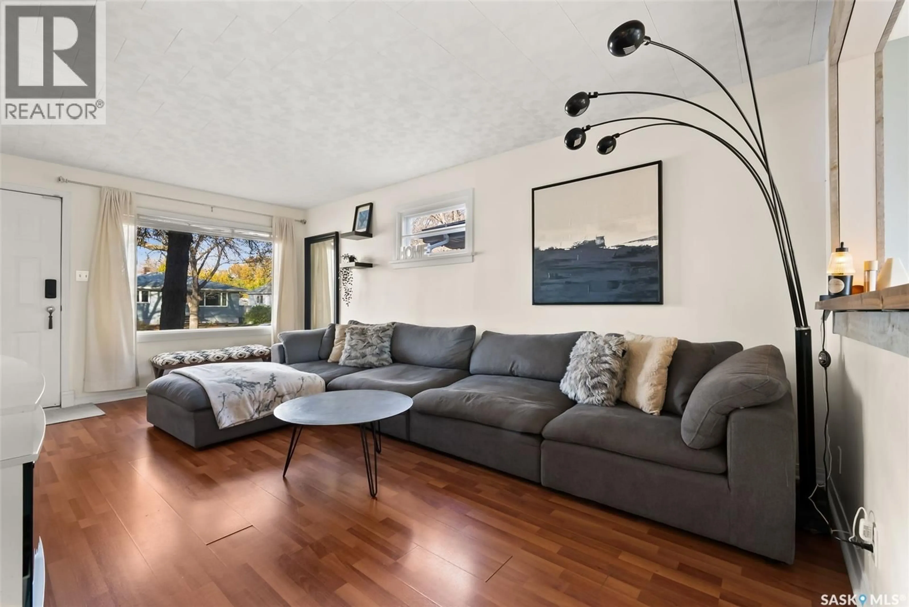 Living room with furniture, wood/laminate floor for 2769 MCARA STREET, Regina Saskatchewan S4N2X2