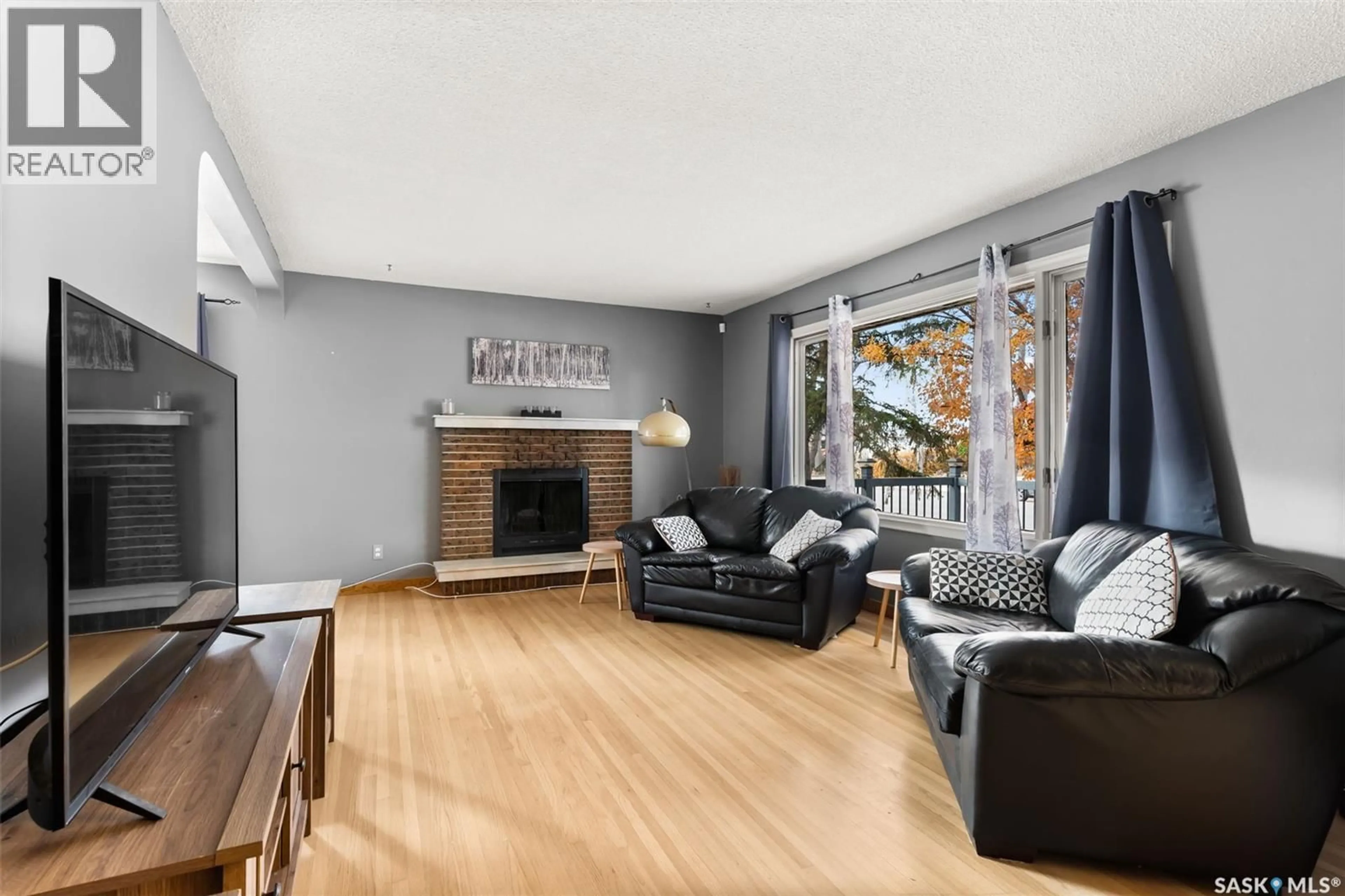 Living room with furniture, wood/laminate floor for 2537 EDWARD STREET, Regina Saskatchewan S4S0M9