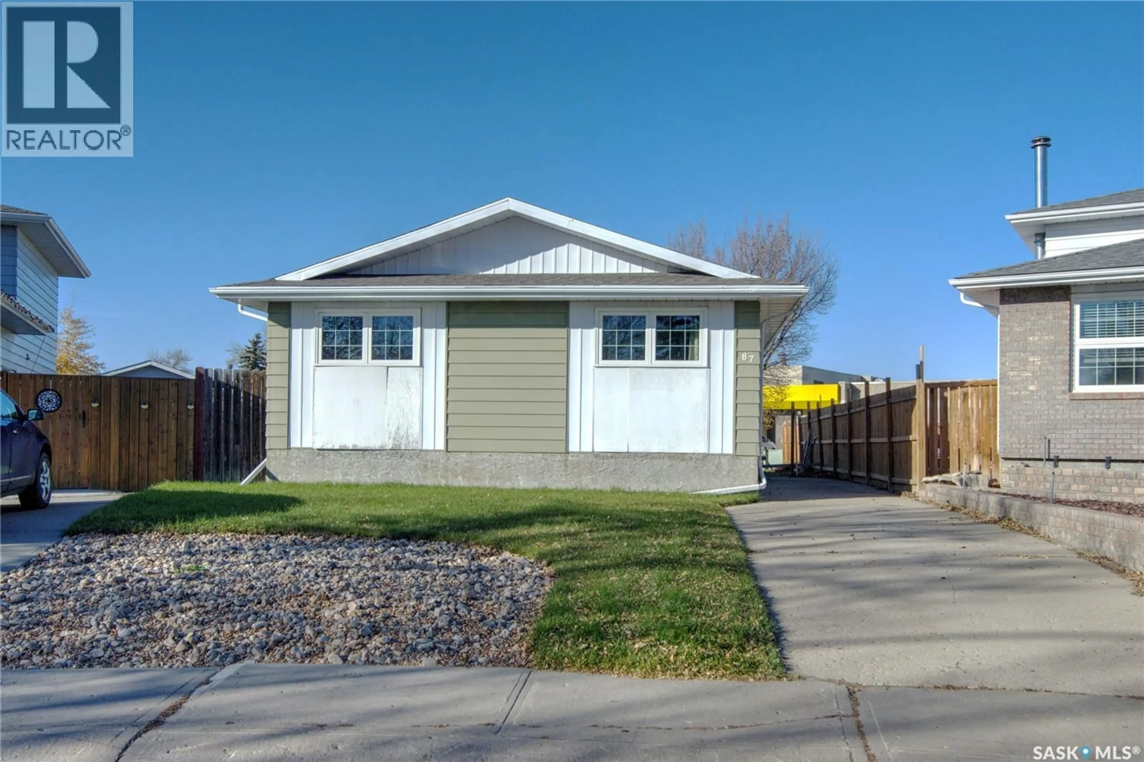 Home with vinyl exterior material, street for 87 CARTER CRESCENT, Regina Saskatchewan S4X2C8