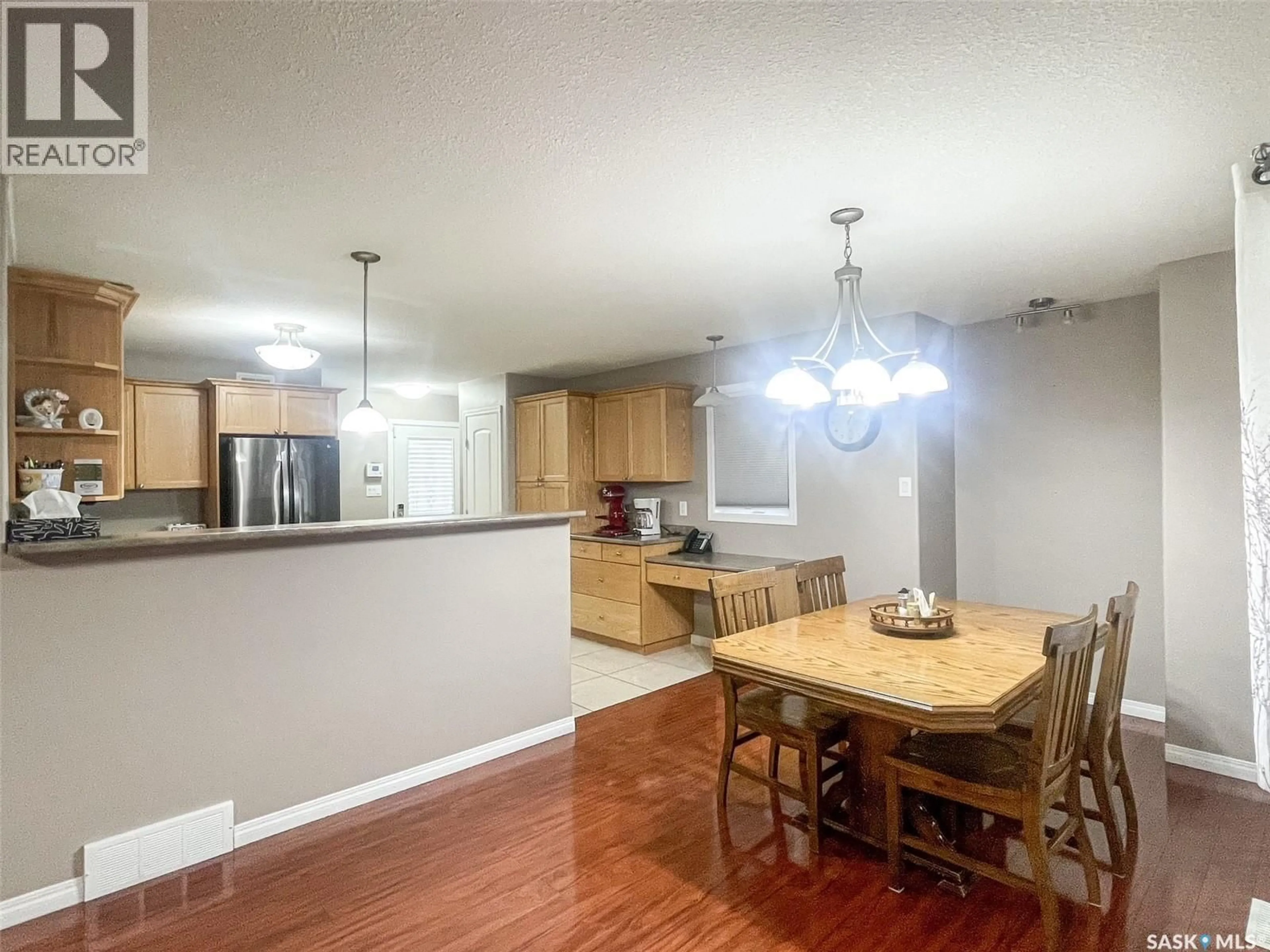 Open concept kitchen, wood/laminate floor for 7 FAIRWAY COURT, Meadow Lake Saskatchewan S9X1Z9