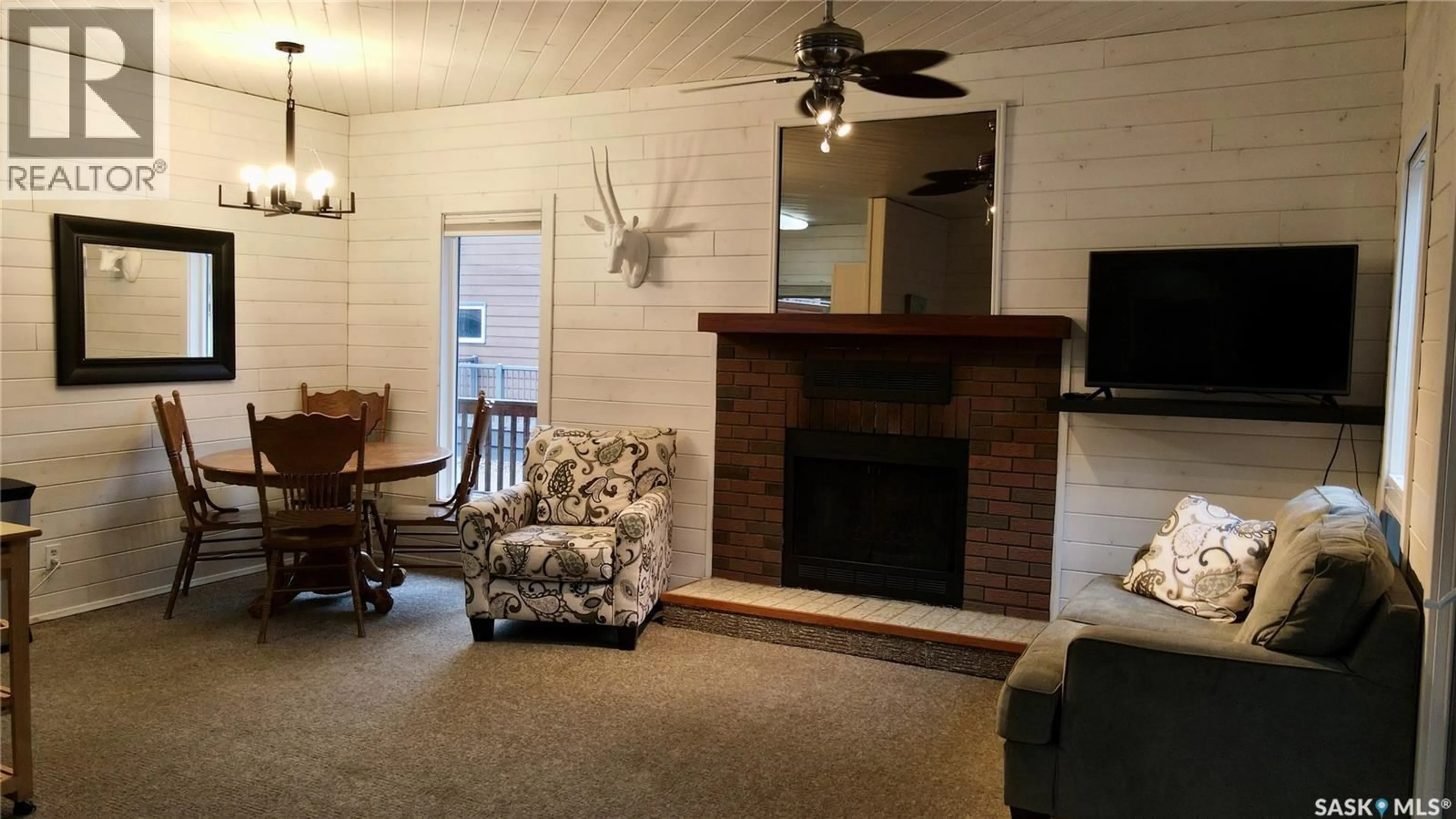 Living room with furniture, wood/laminate floor for 5 PERCH PLACE, Candle Lake Saskatchewan S0J3E0