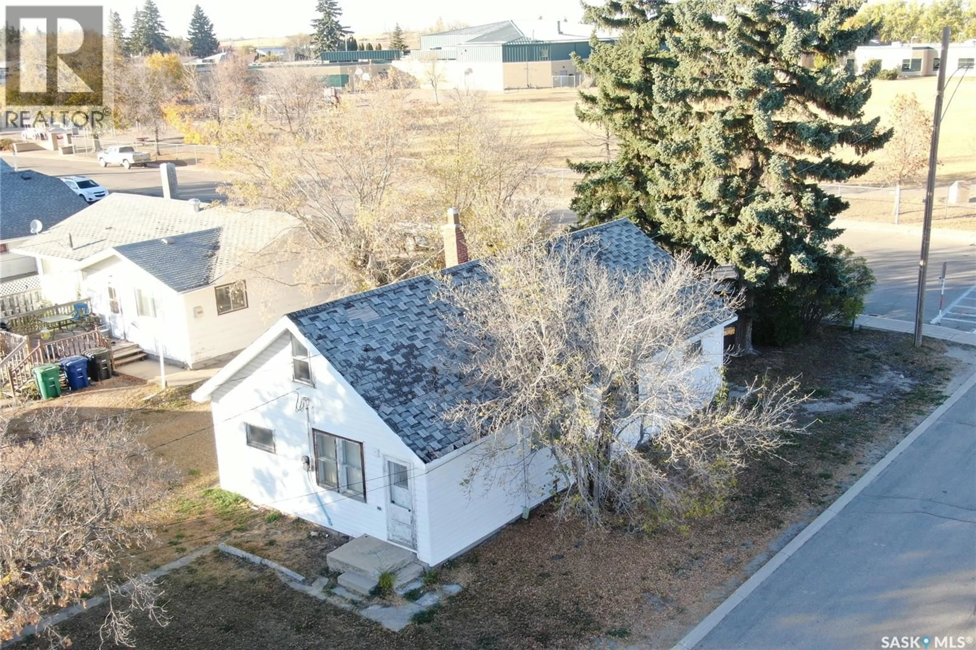 A pic from outside/outdoor area/front of a property/back of a property/a pic from drone, street for 220 6TH AVENUE, Biggar Saskatchewan S0K0M0