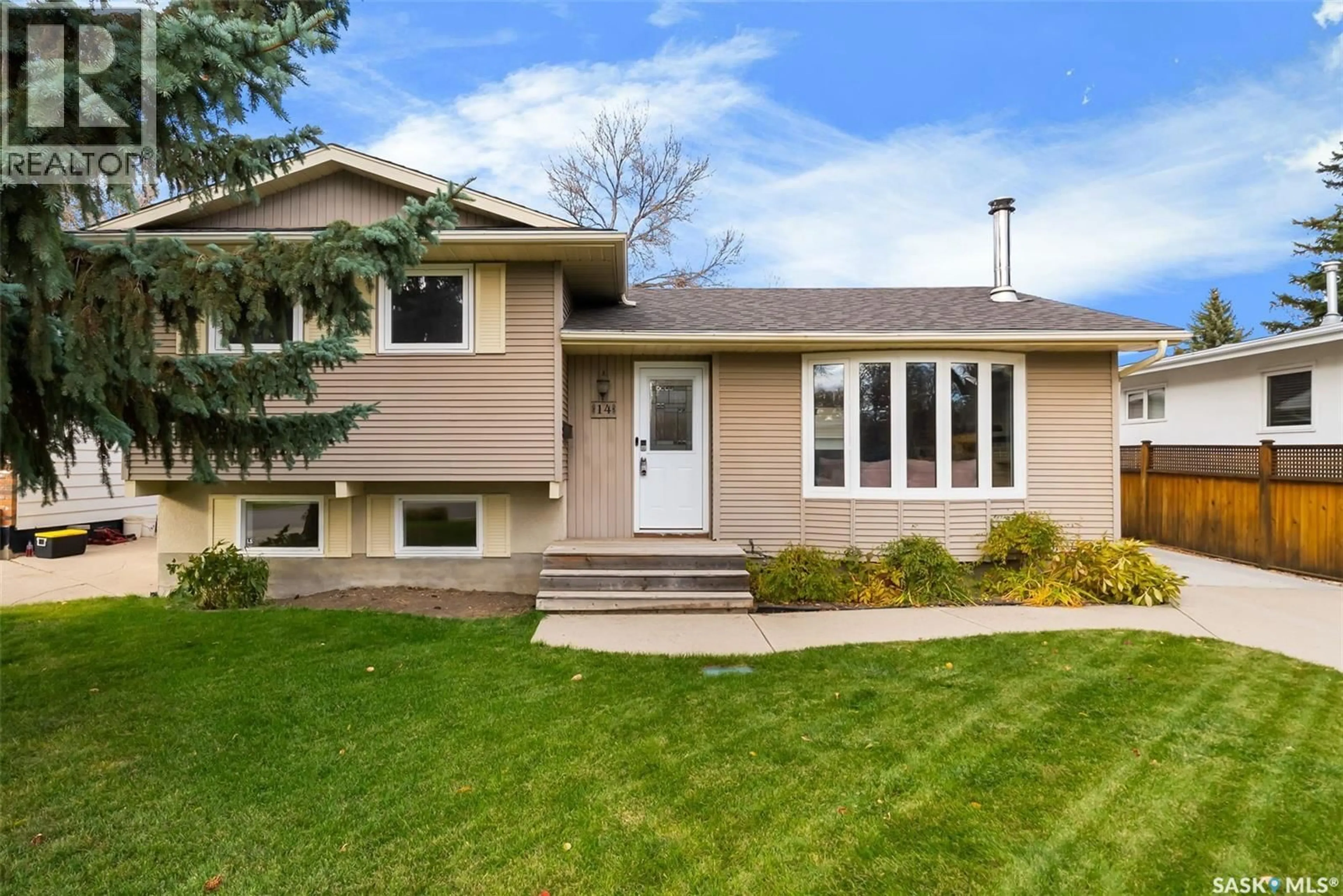 Home with vinyl exterior material, street for 14 PEARSON PLACE, Regina Saskatchewan S4S5W2
