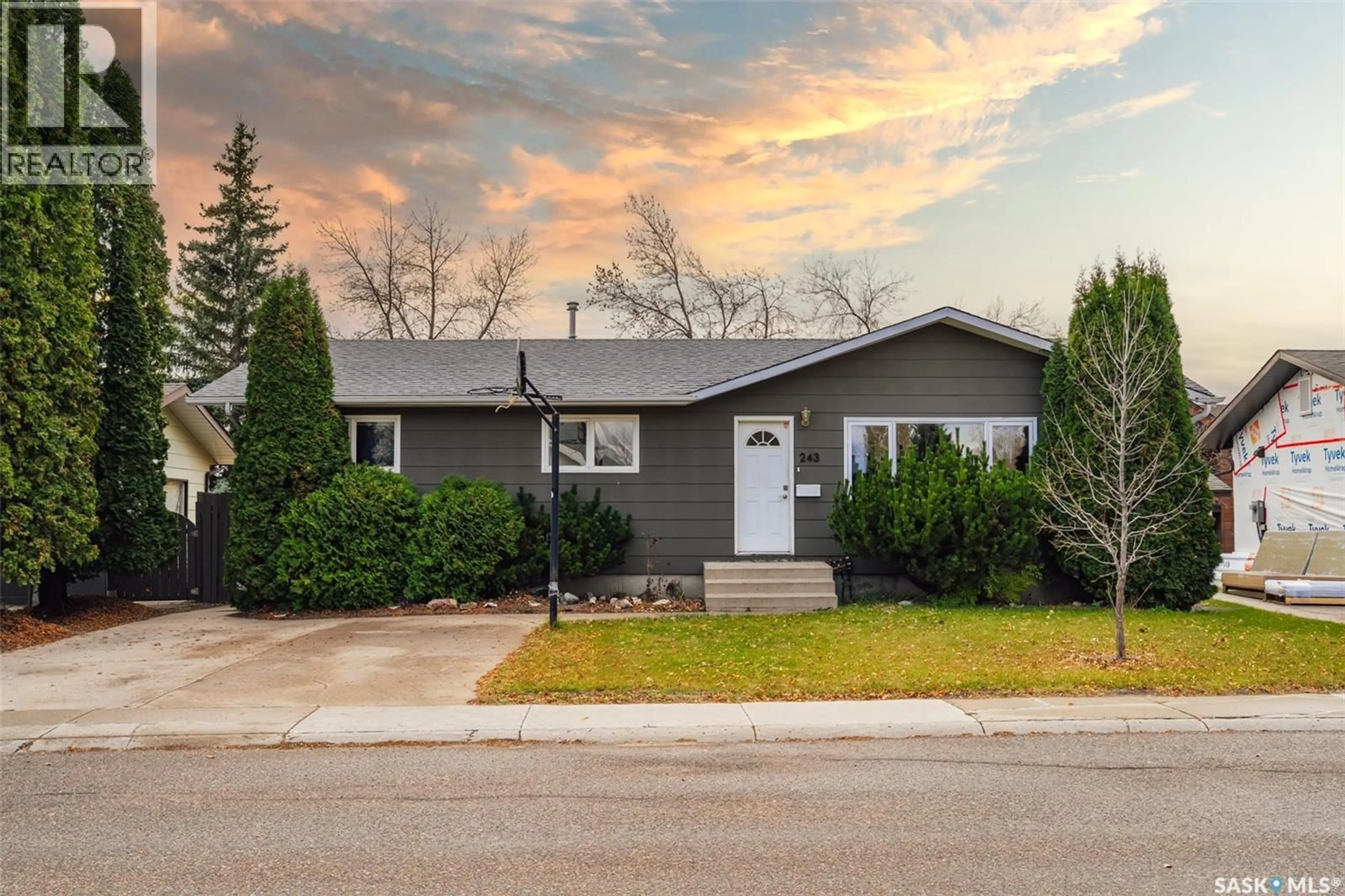 Home with vinyl exterior material, street for 243 ROBORECKI CRESCENT, Saskatoon Saskatchewan S7K5L1