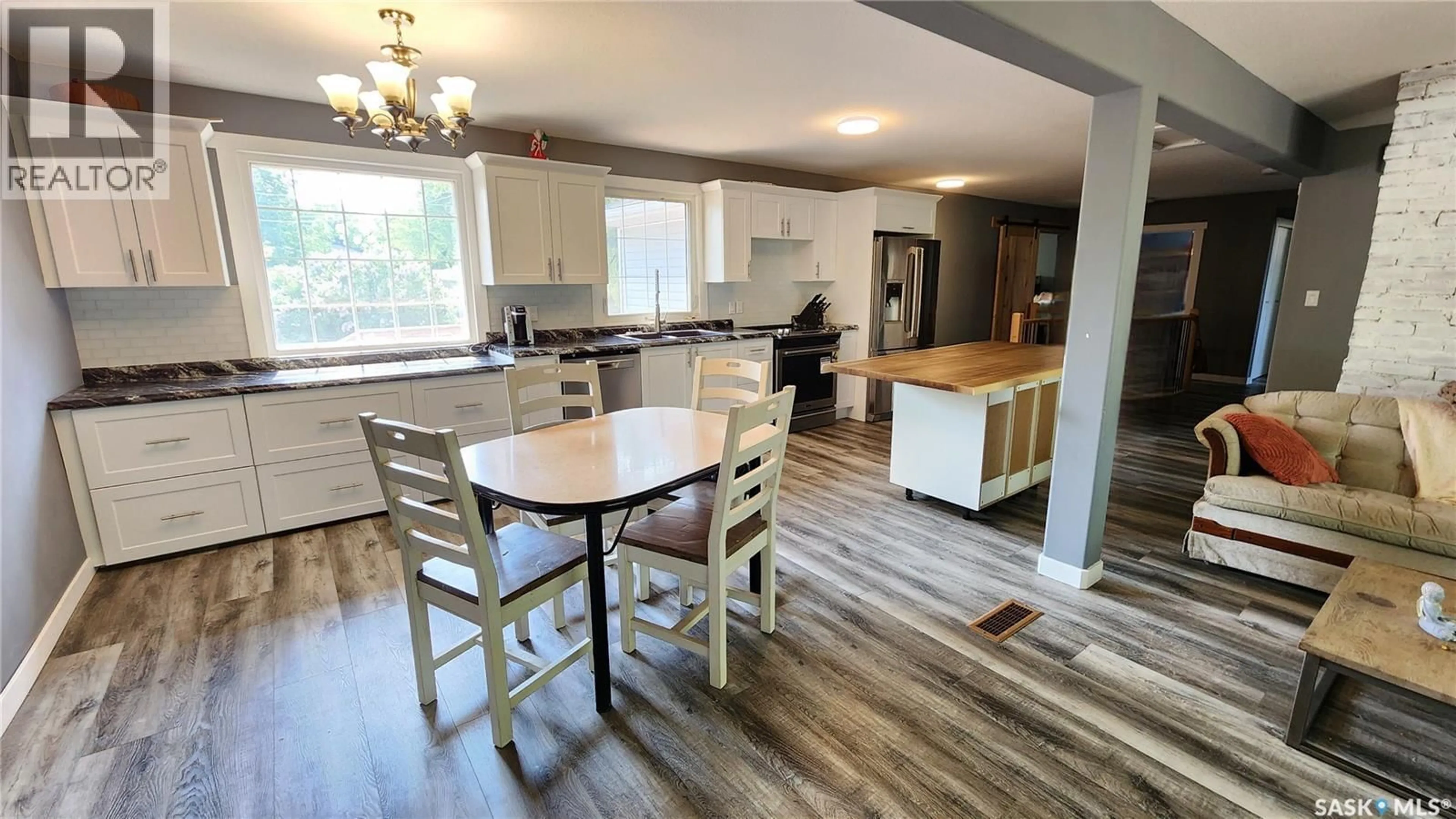 Open concept kitchen, wood/laminate floor for 208 4TH STREET, Wilkie Saskatchewan S0M4W0