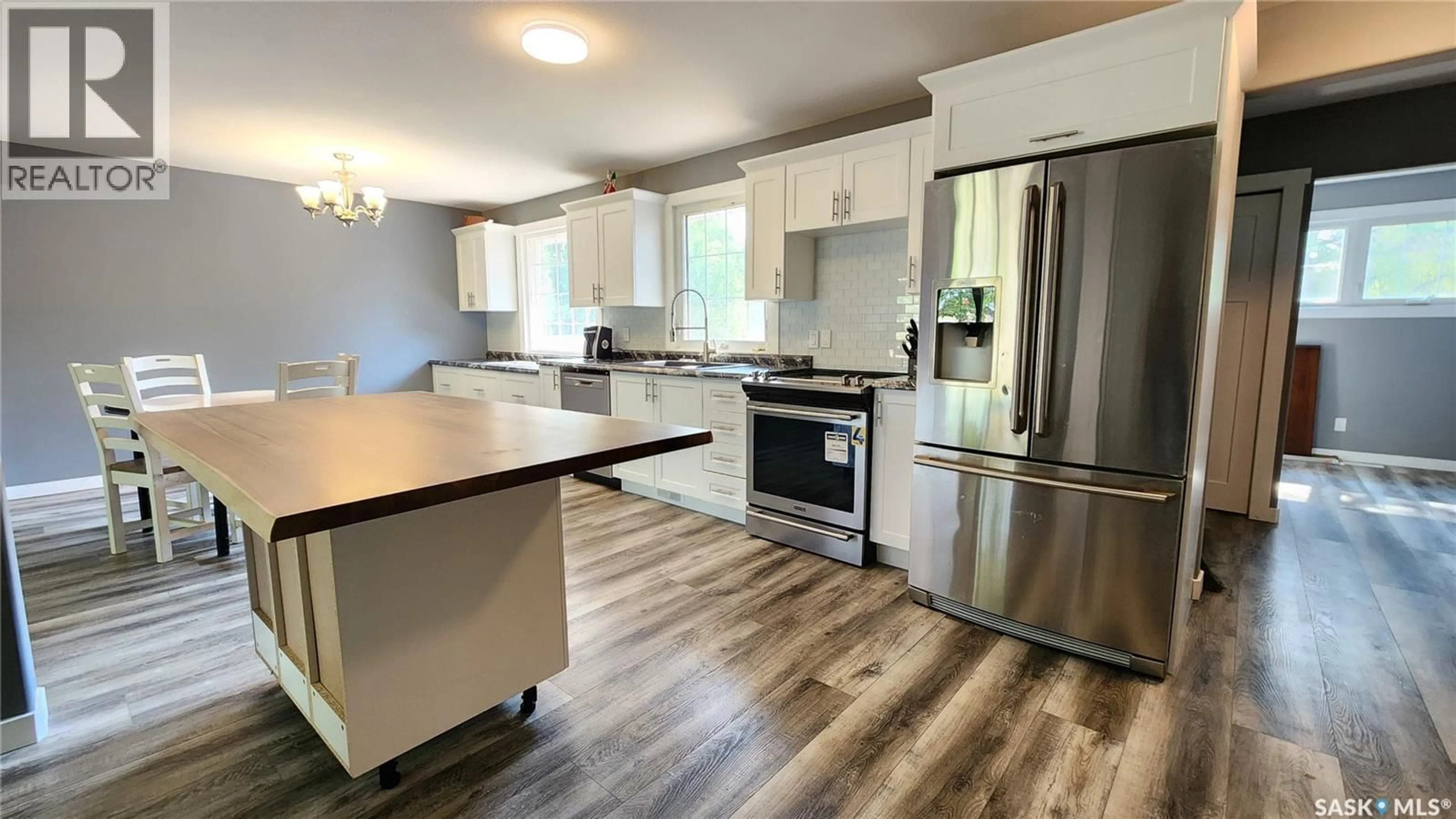 Open concept kitchen, wood/laminate floor for 208 4TH STREET, Wilkie Saskatchewan S0M4W0