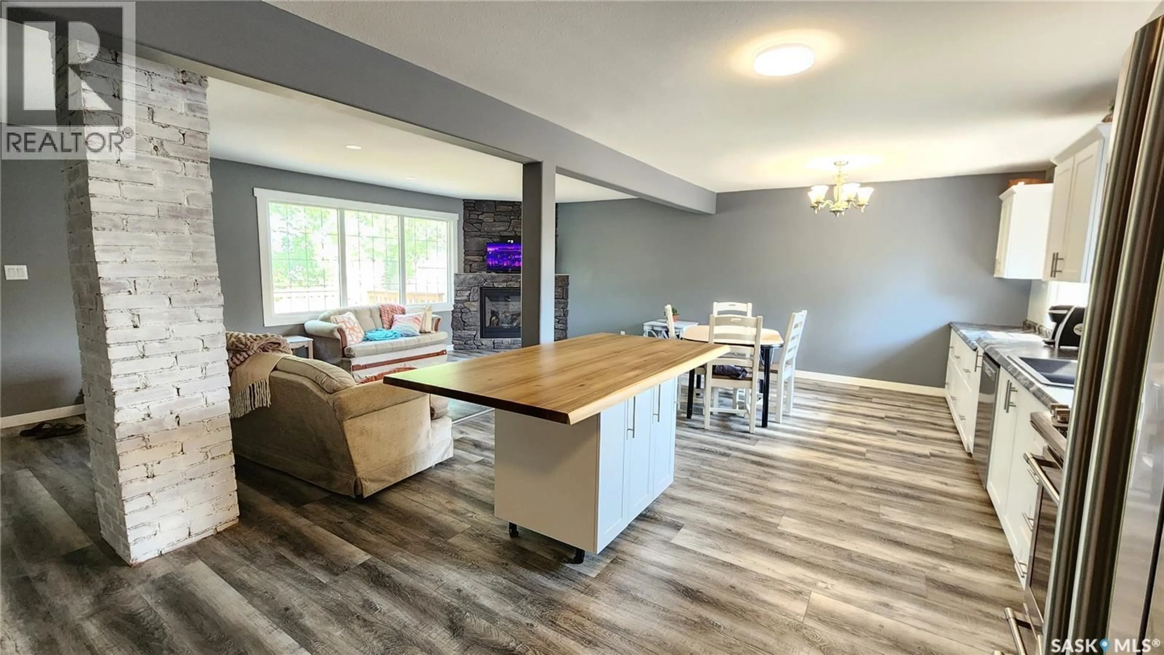Open concept kitchen, wood/laminate floor for 208 4TH STREET, Wilkie Saskatchewan S0M4W0