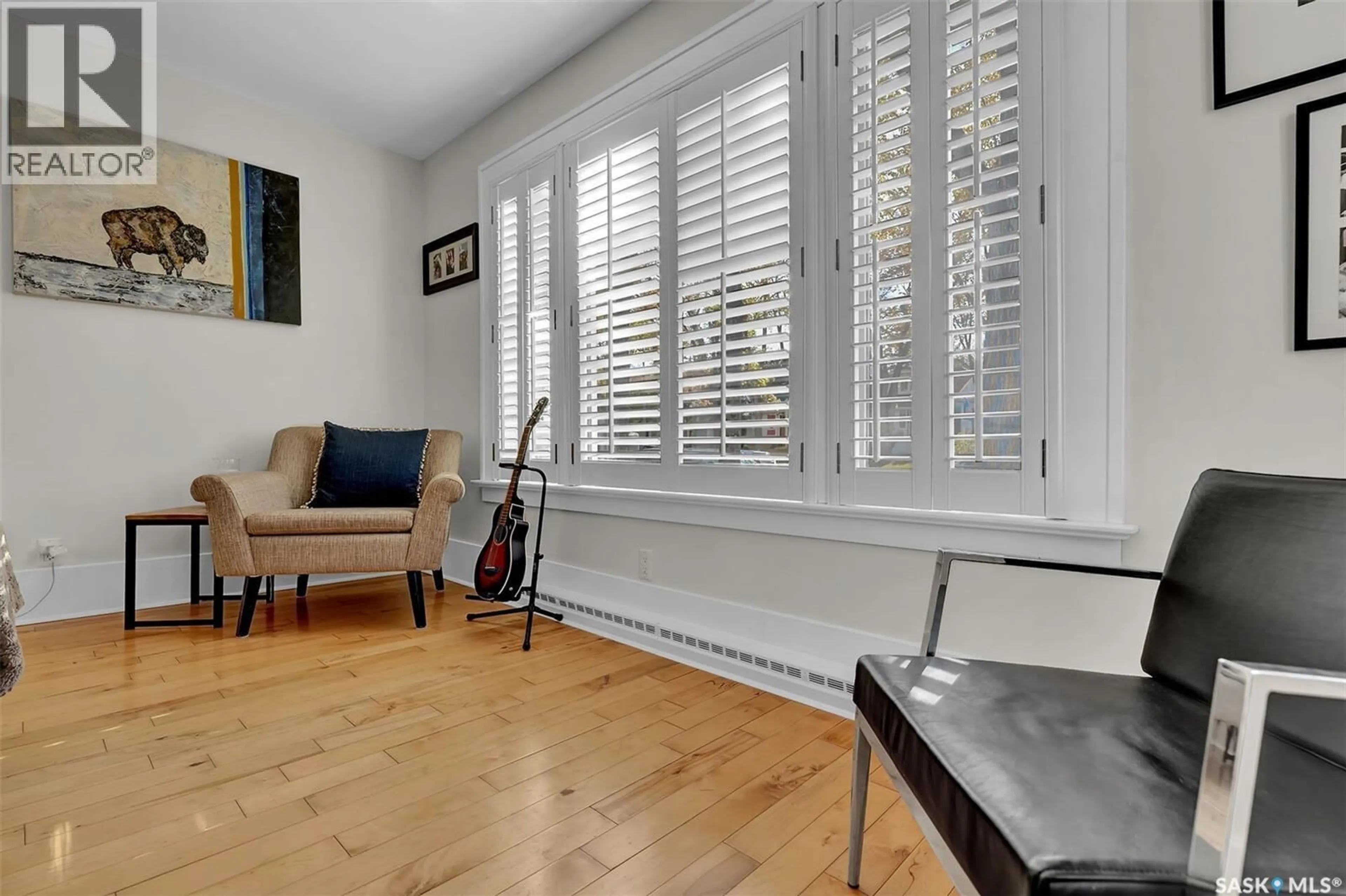 Living room with furniture, wood/laminate floor for 2736 REGINA AVENUE, Regina Saskatchewan S4S0G5