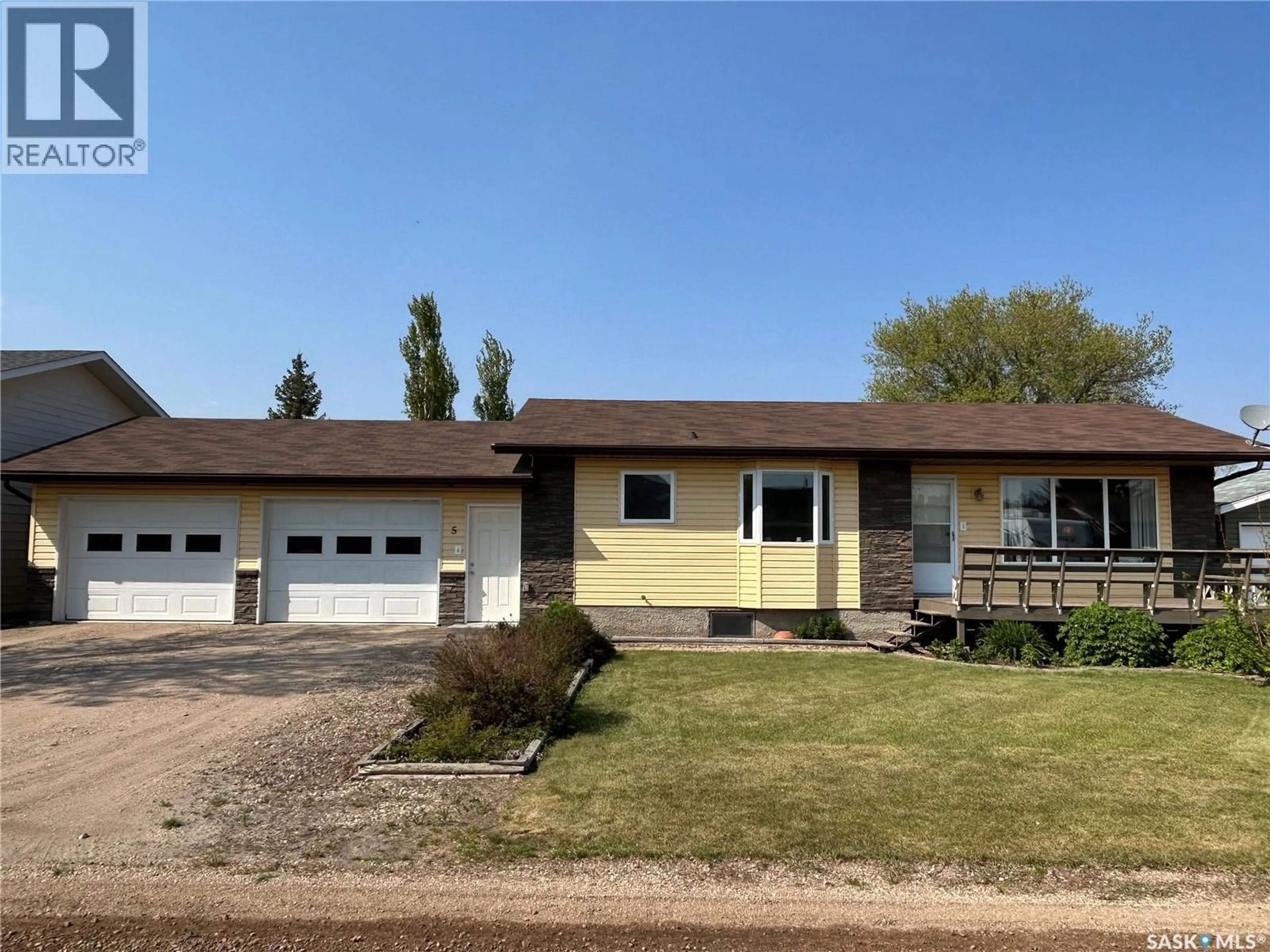Home with vinyl exterior material, street for 5 MAIN CRESCENT, Muenster Saskatchewan S0K2Y0