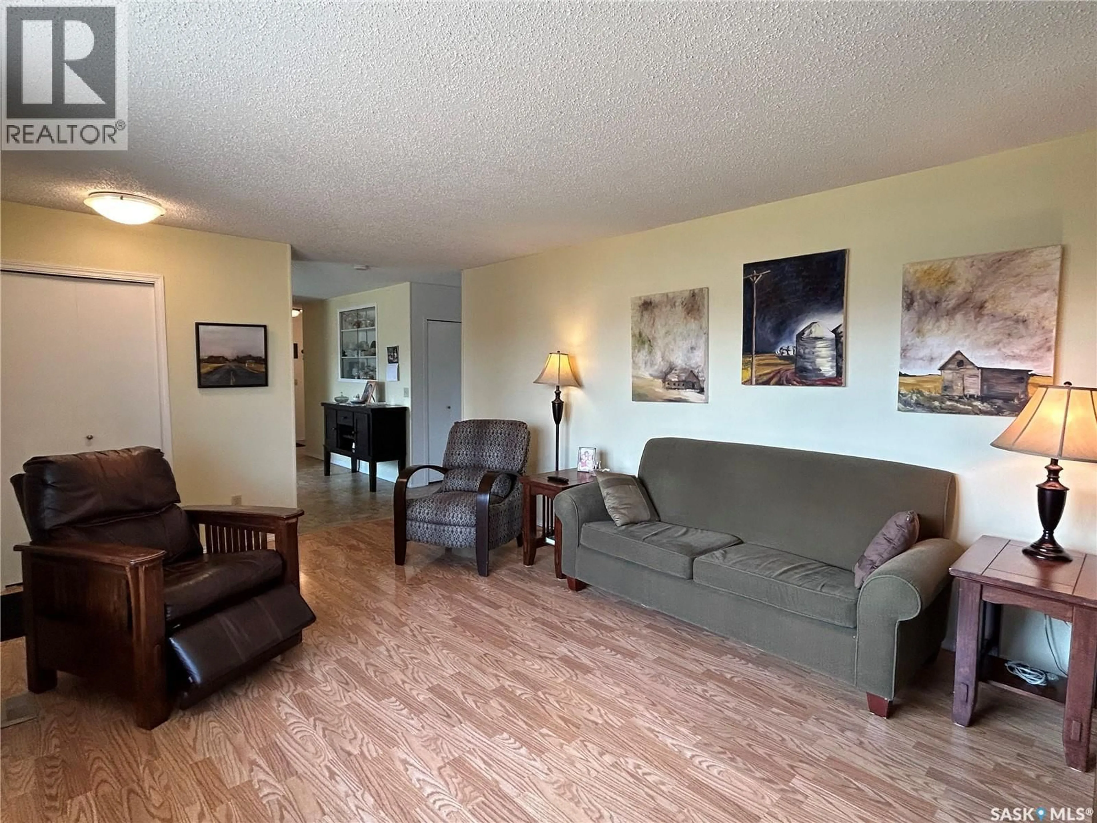 Living room with furniture, wood/laminate floor for 5 MAIN CRESCENT, Muenster Saskatchewan S0K2Y0