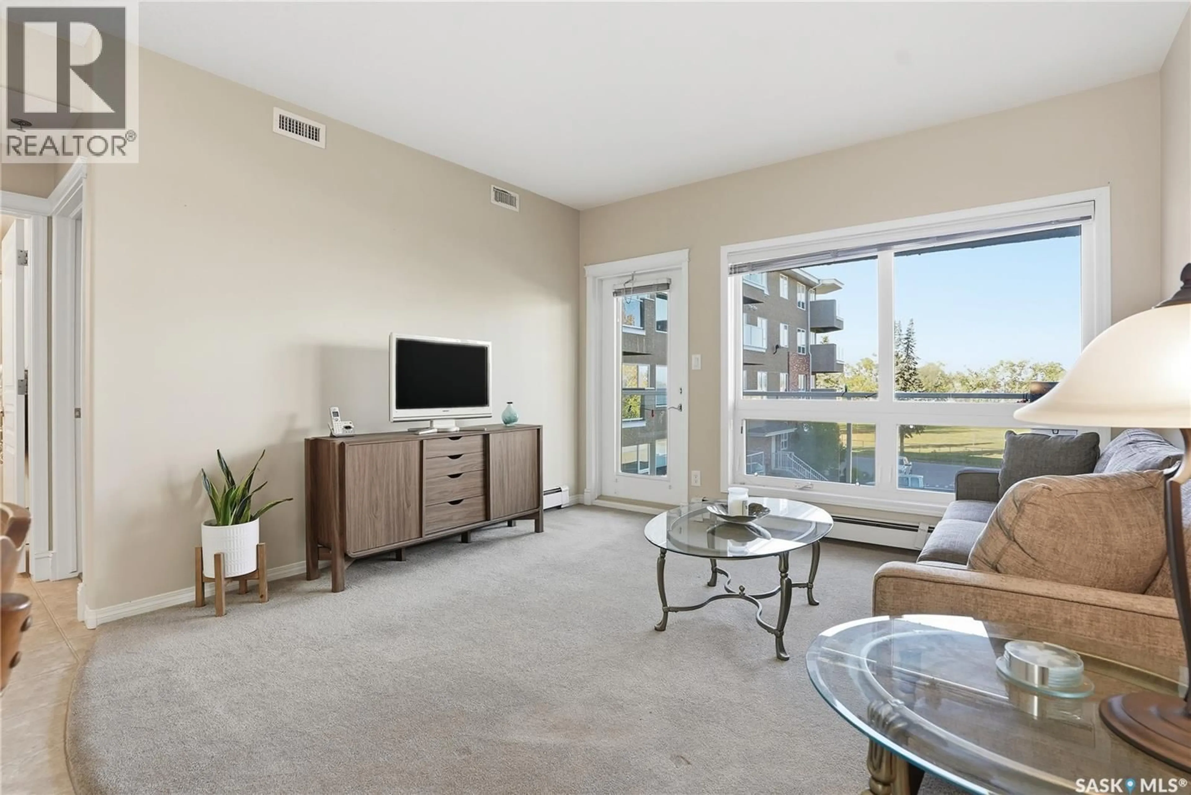 Living room with furniture, unknown for 204 102 ARMISTICE WAY, Saskatoon Saskatchewan S7J2Z6