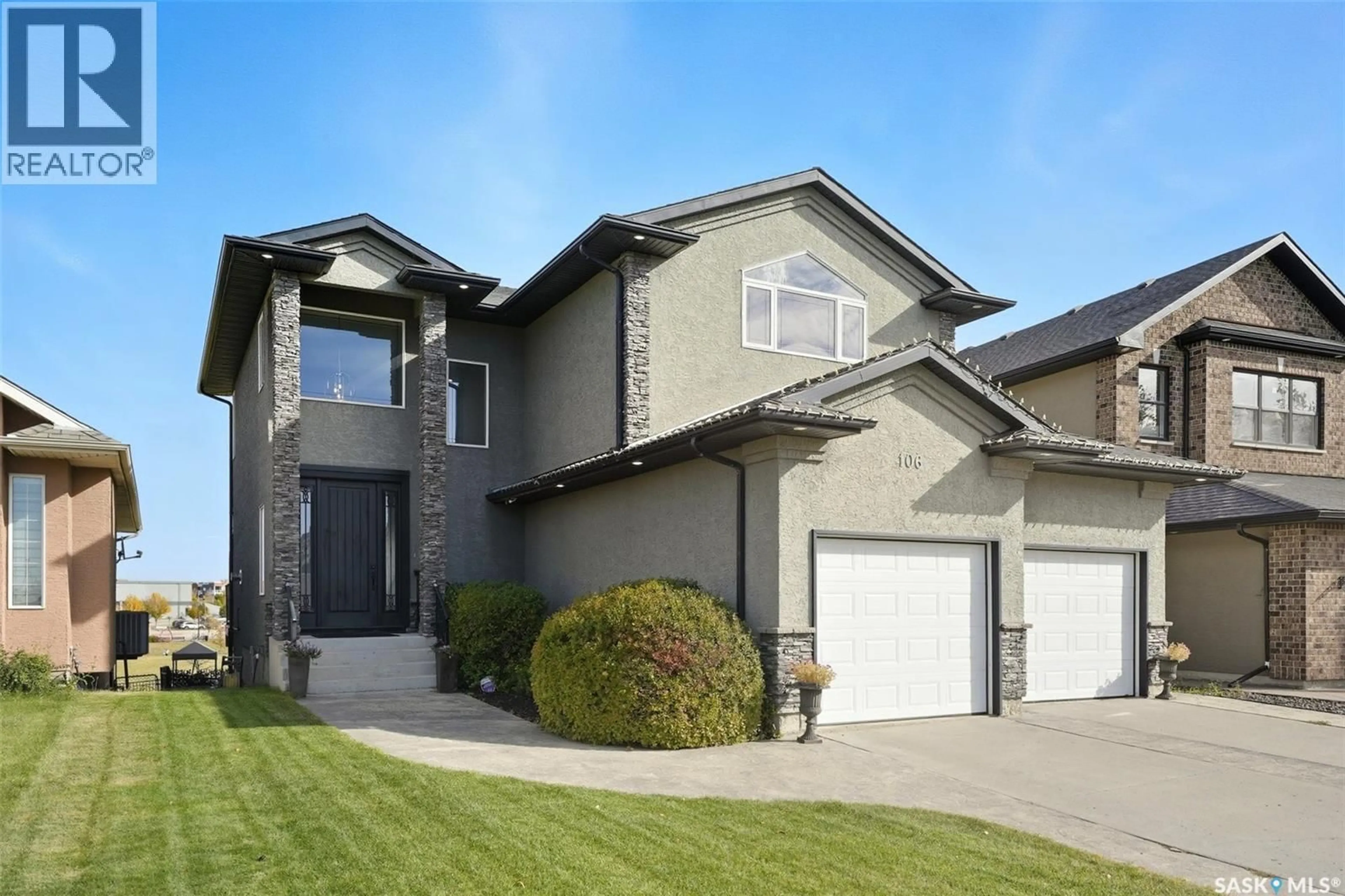 Home with vinyl exterior material, street for 106 THODE AVENUE, Saskatoon Saskatchewan S7W1A1