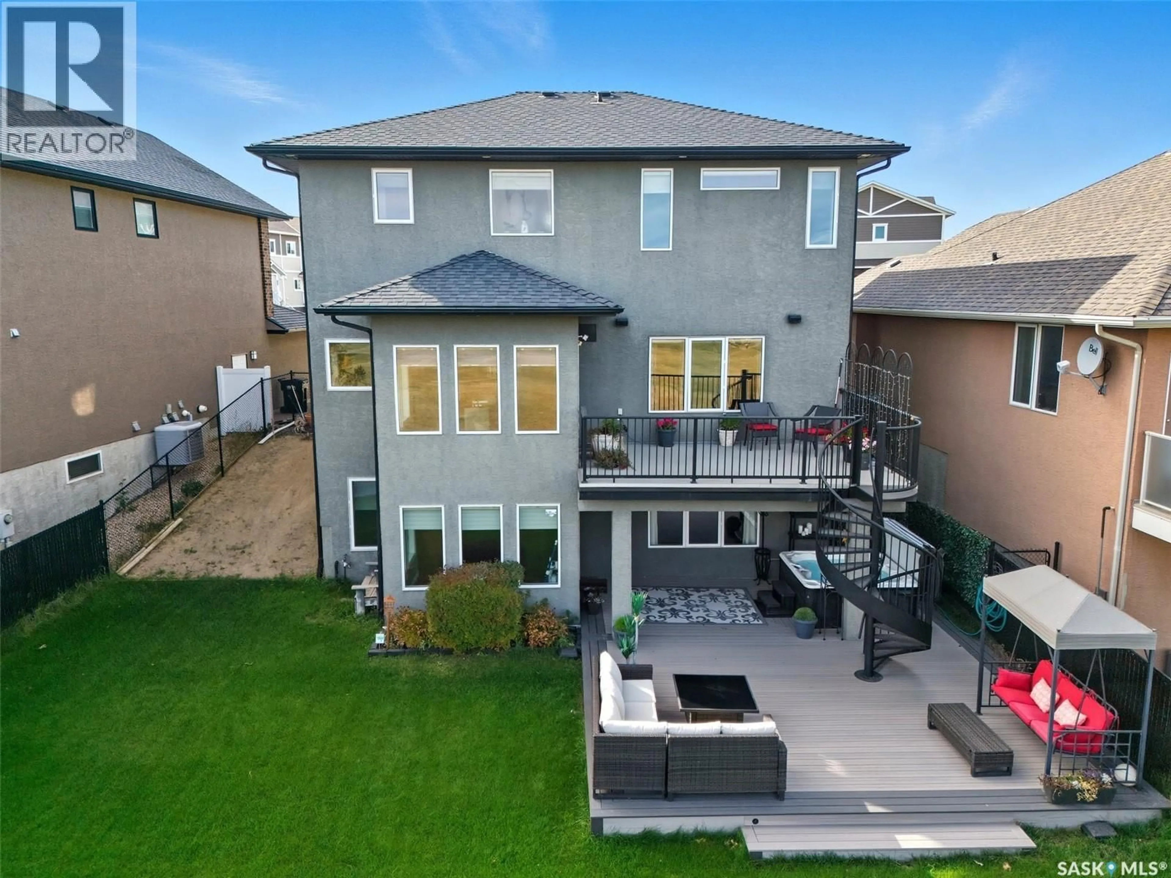 A pic from outside/outdoor area/front of a property/back of a property/a pic from drone, unknown for 106 THODE AVENUE, Saskatoon Saskatchewan S7W1A1