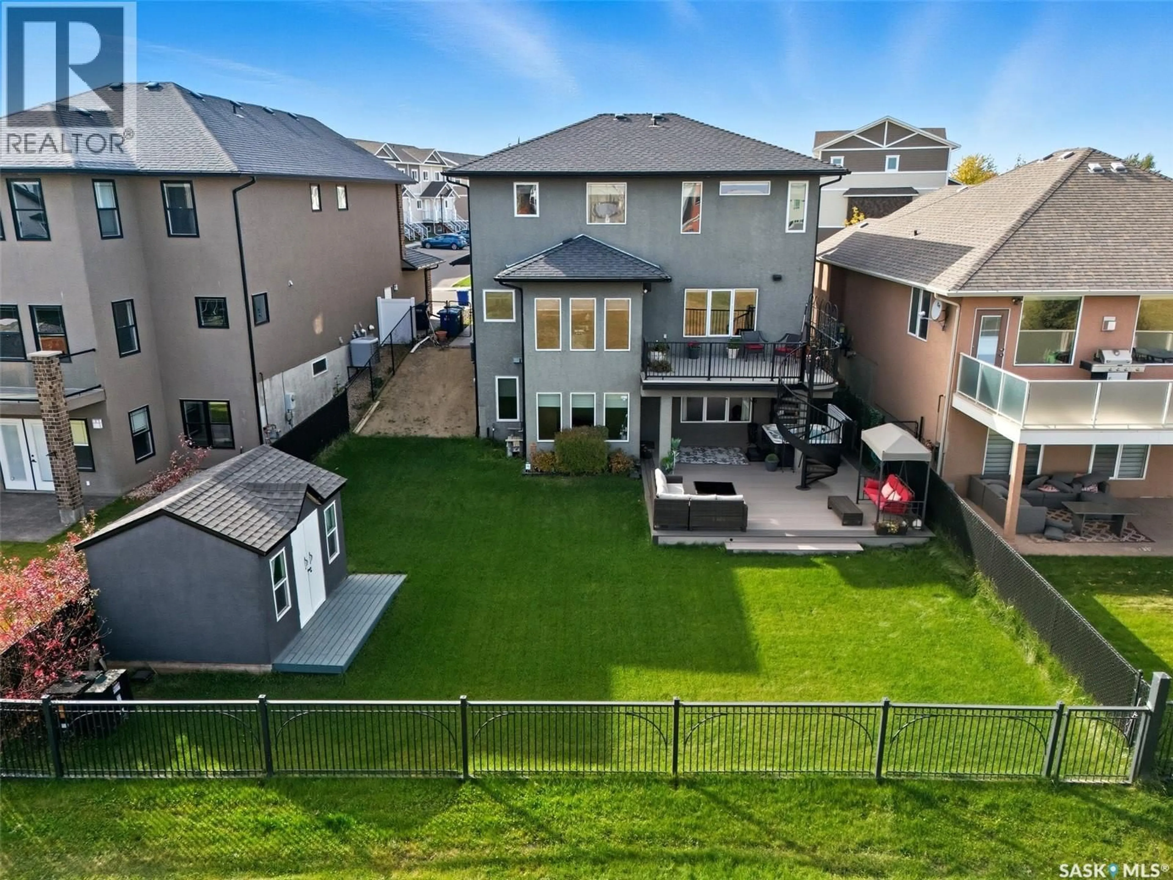 A pic from outside/outdoor area/front of a property/back of a property/a pic from drone, unknown for 106 THODE AVENUE, Saskatoon Saskatchewan S7W1A1