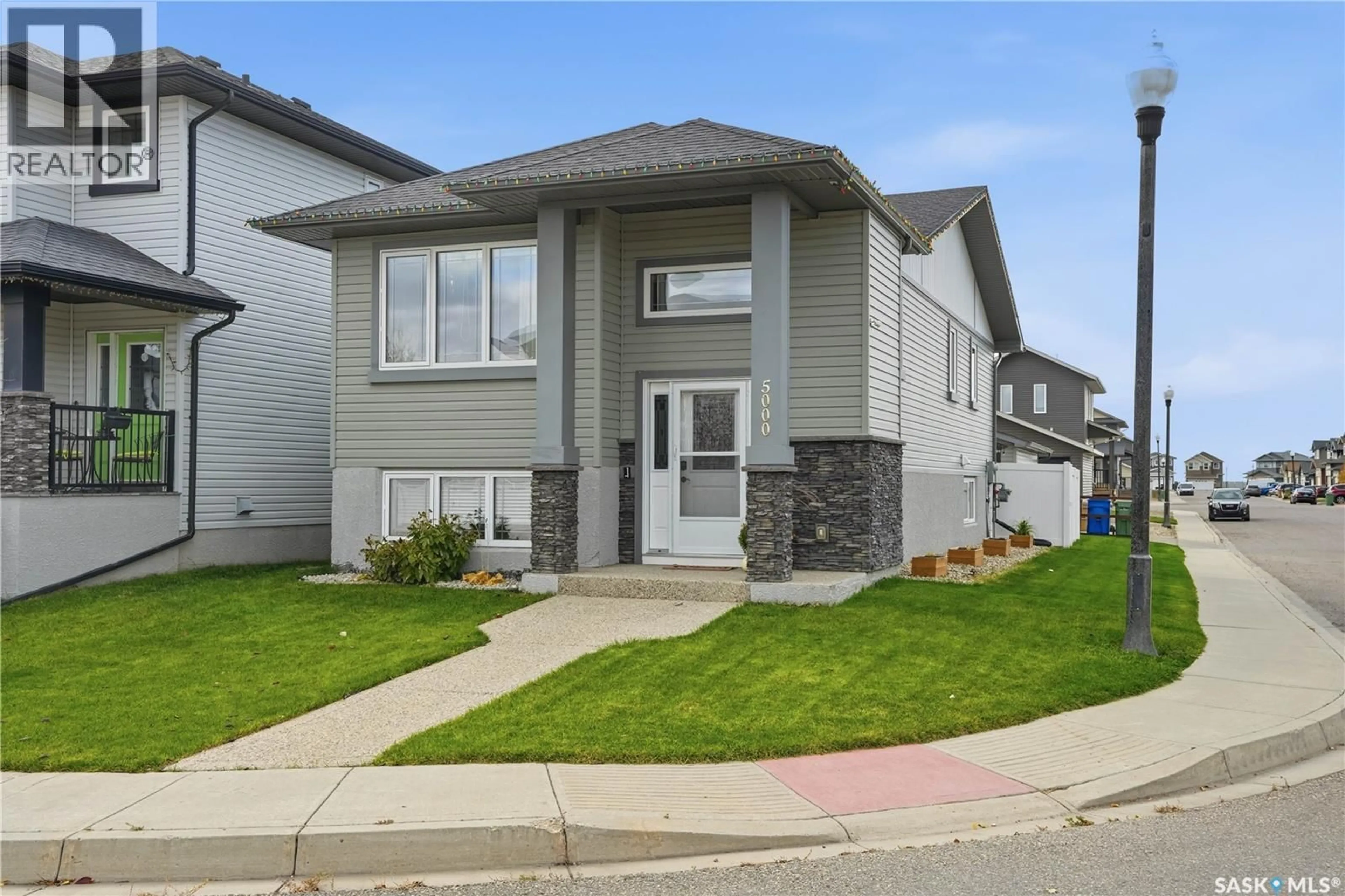 Home with vinyl exterior material, street for 5000 AERIAL CRESCENT, Regina Saskatchewan S4W0C9