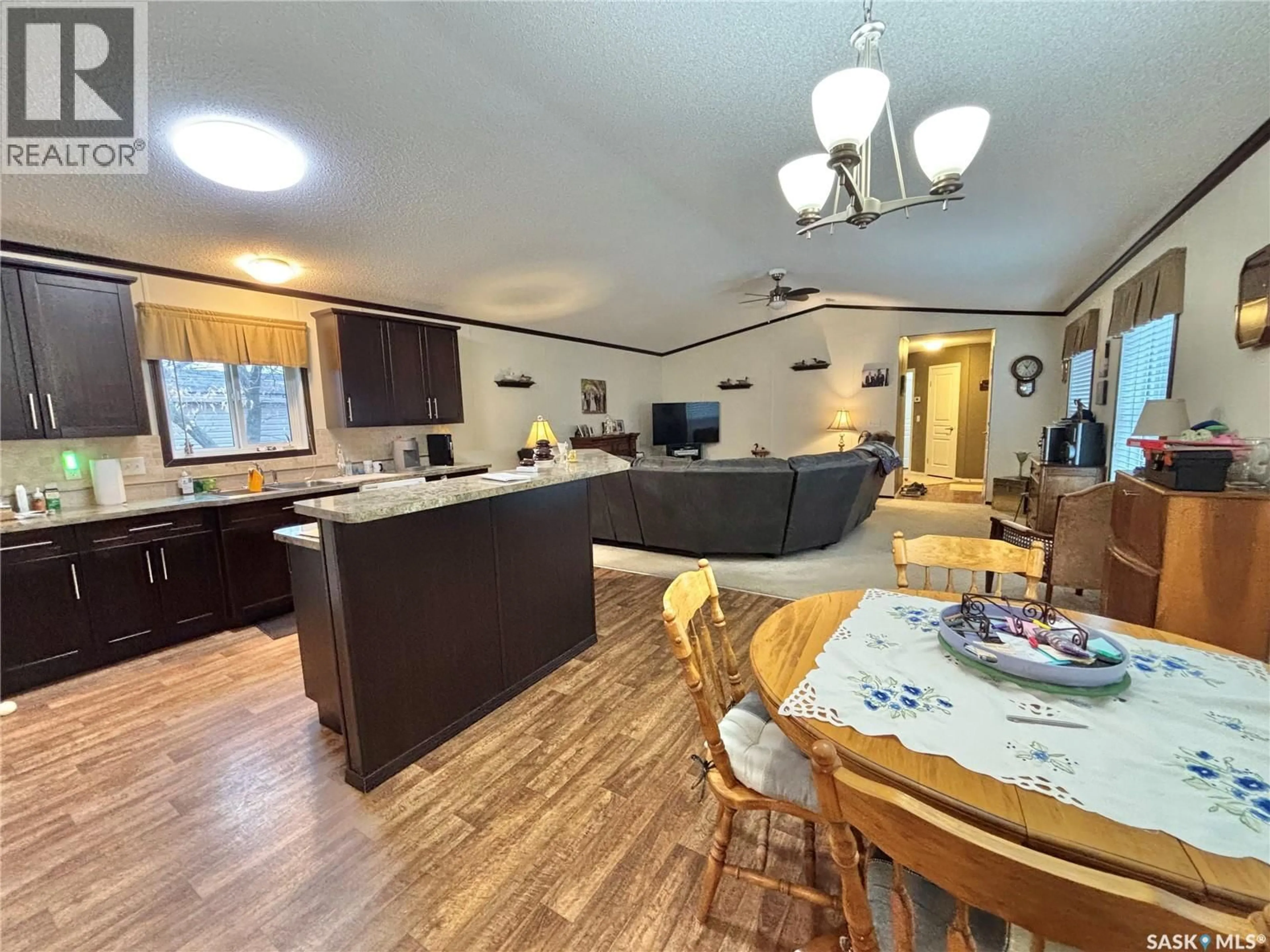 Open concept kitchen, wood/laminate floor for 47 WESTSHORE GREENS, Yorkton Saskatchewan S3N2V4