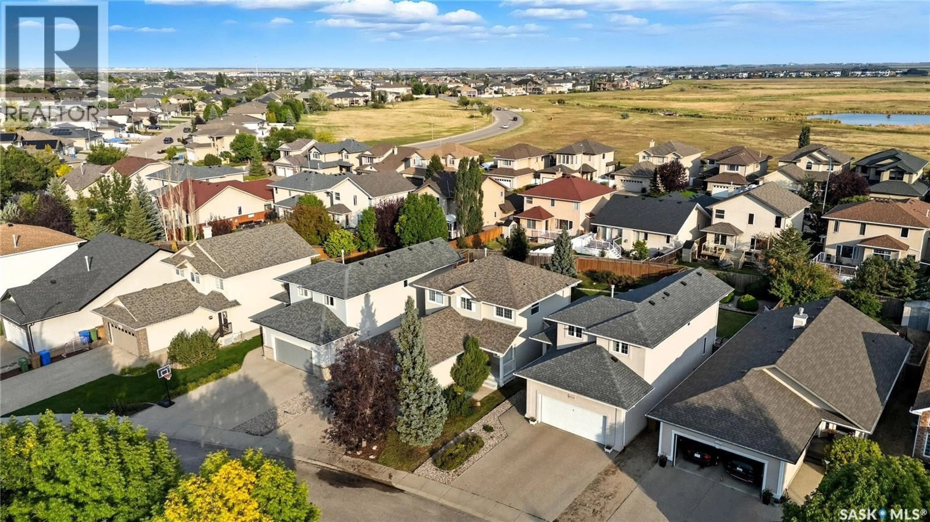 A pic from outside/outdoor area/front of a property/back of a property/a pic from drone, street for 10342 WASCANA ESTATES, Regina Saskatchewan S4V2X1