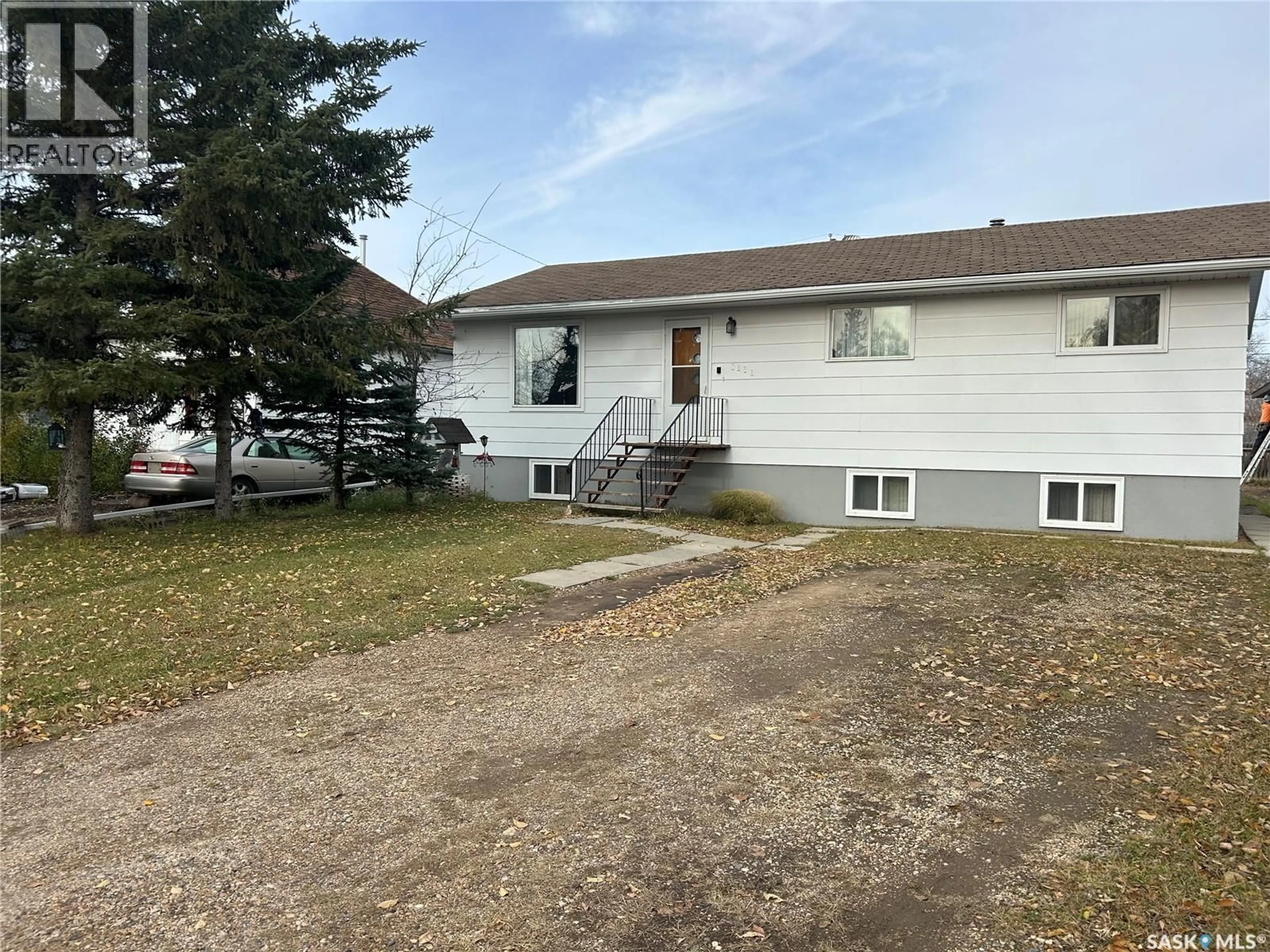 A pic from outside/outdoor area/front of a property/back of a property/a pic from drone, street for 1111 100TH AVENUE, Tisdale Saskatchewan S0E1T0