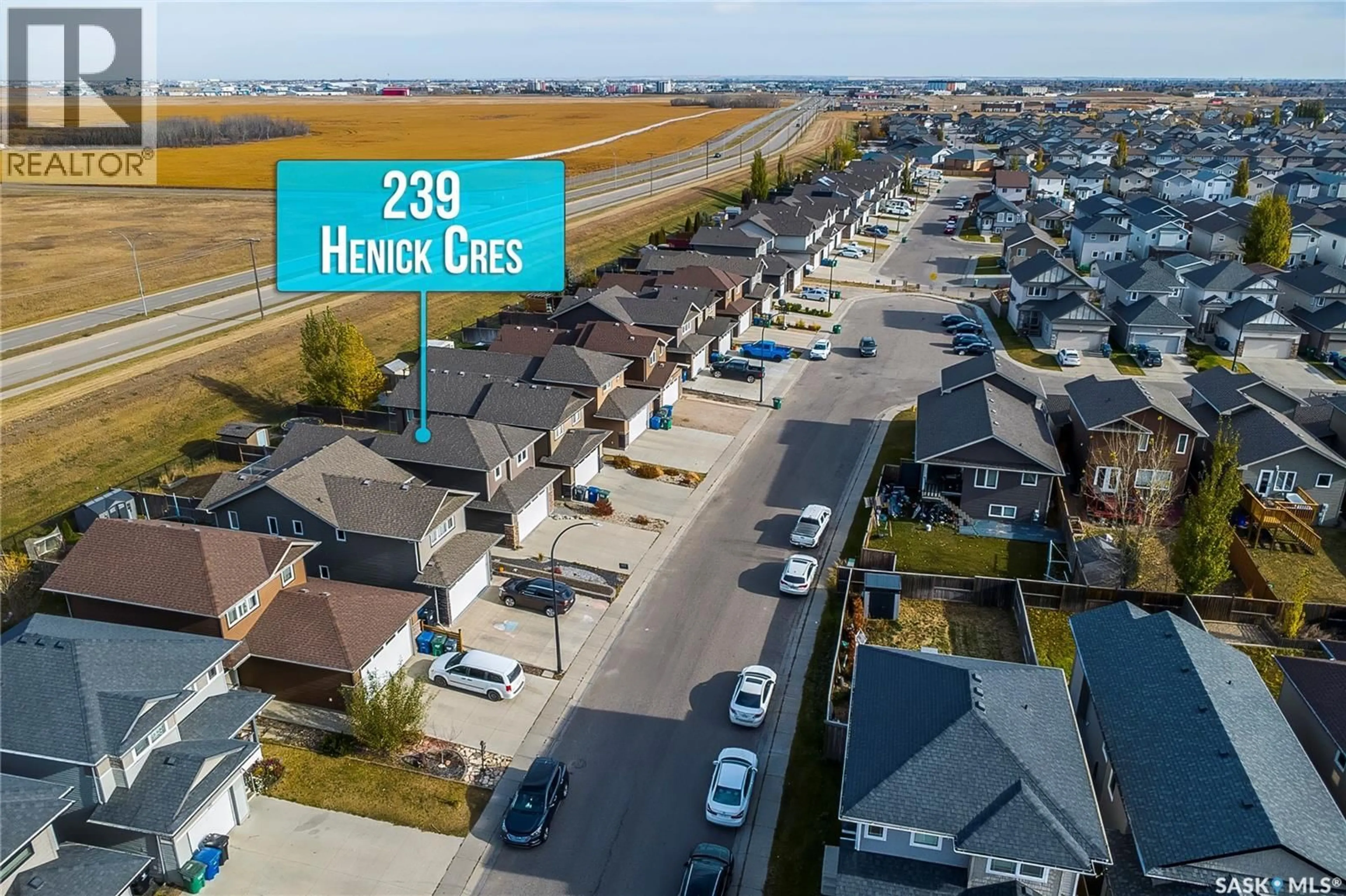 A pic from outside/outdoor area/front of a property/back of a property/a pic from drone, street for 239 HENICK CRESCENT, Saskatoon Saskatchewan S7R0J9