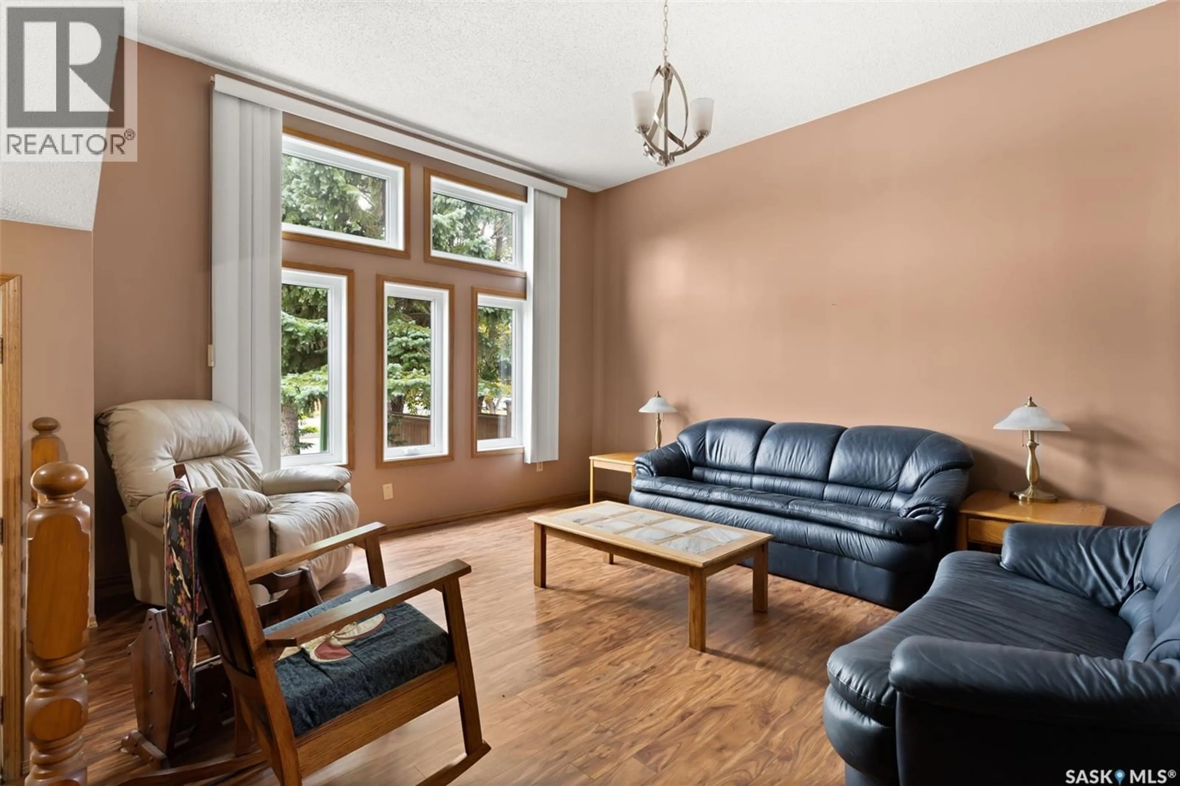 Living room with furniture, wood/laminate floor for 3006 PHANEUF CRESCENT, Regina Saskatchewan S4V1T6