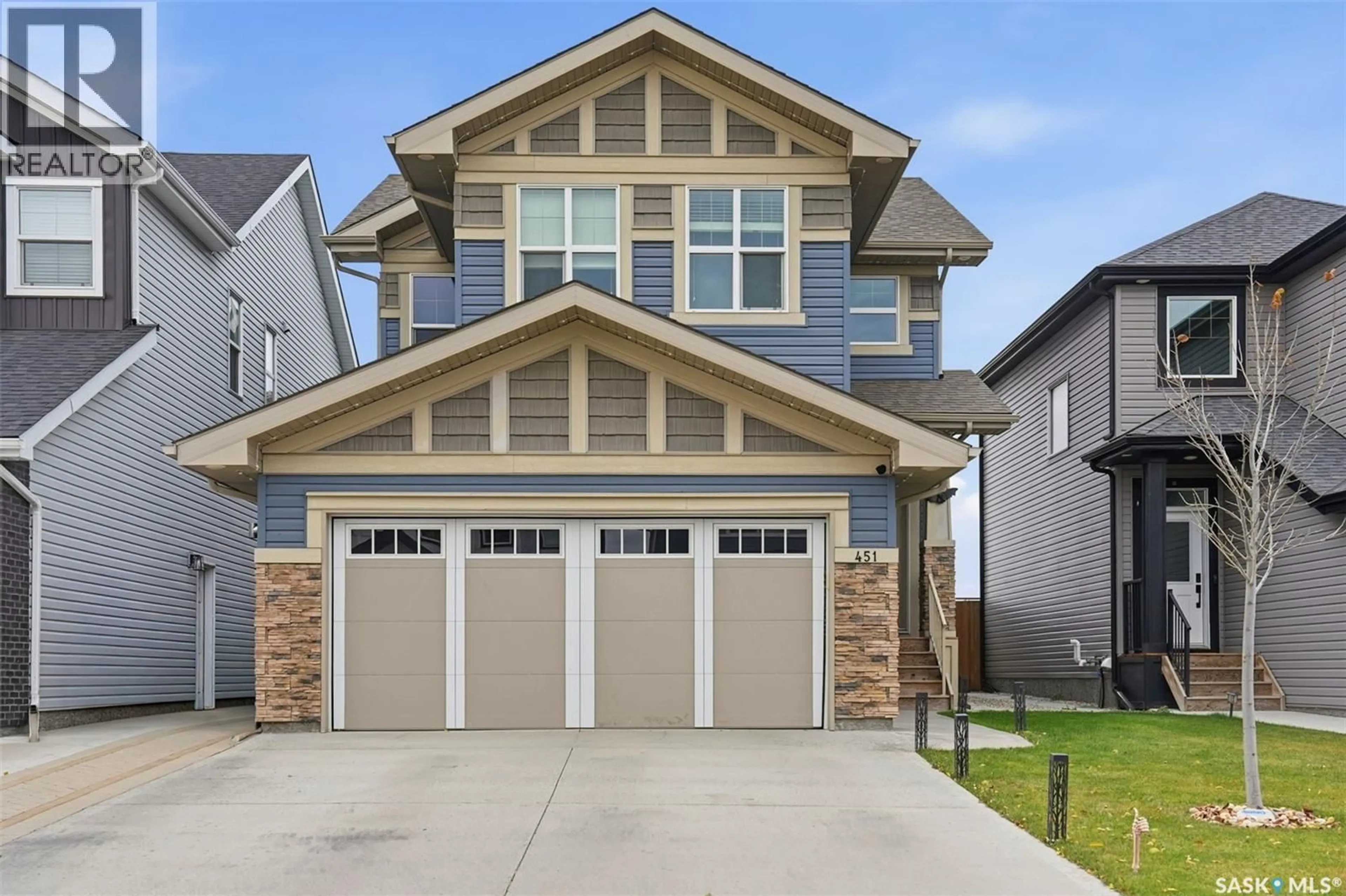 Home with vinyl exterior material, street for 451 MCFAULL CRESCENT, Saskatoon Saskatchewan S7V0T2