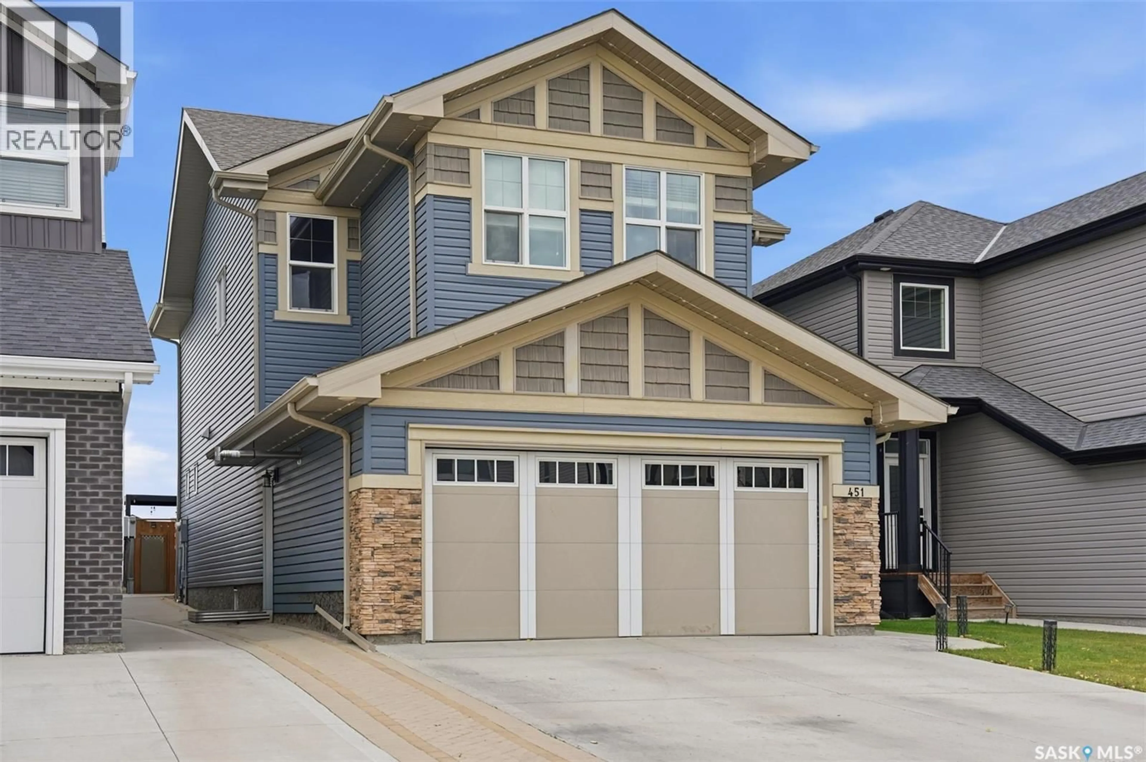 Home with vinyl exterior material, street for 451 MCFAULL CRESCENT, Saskatoon Saskatchewan S7V0T2