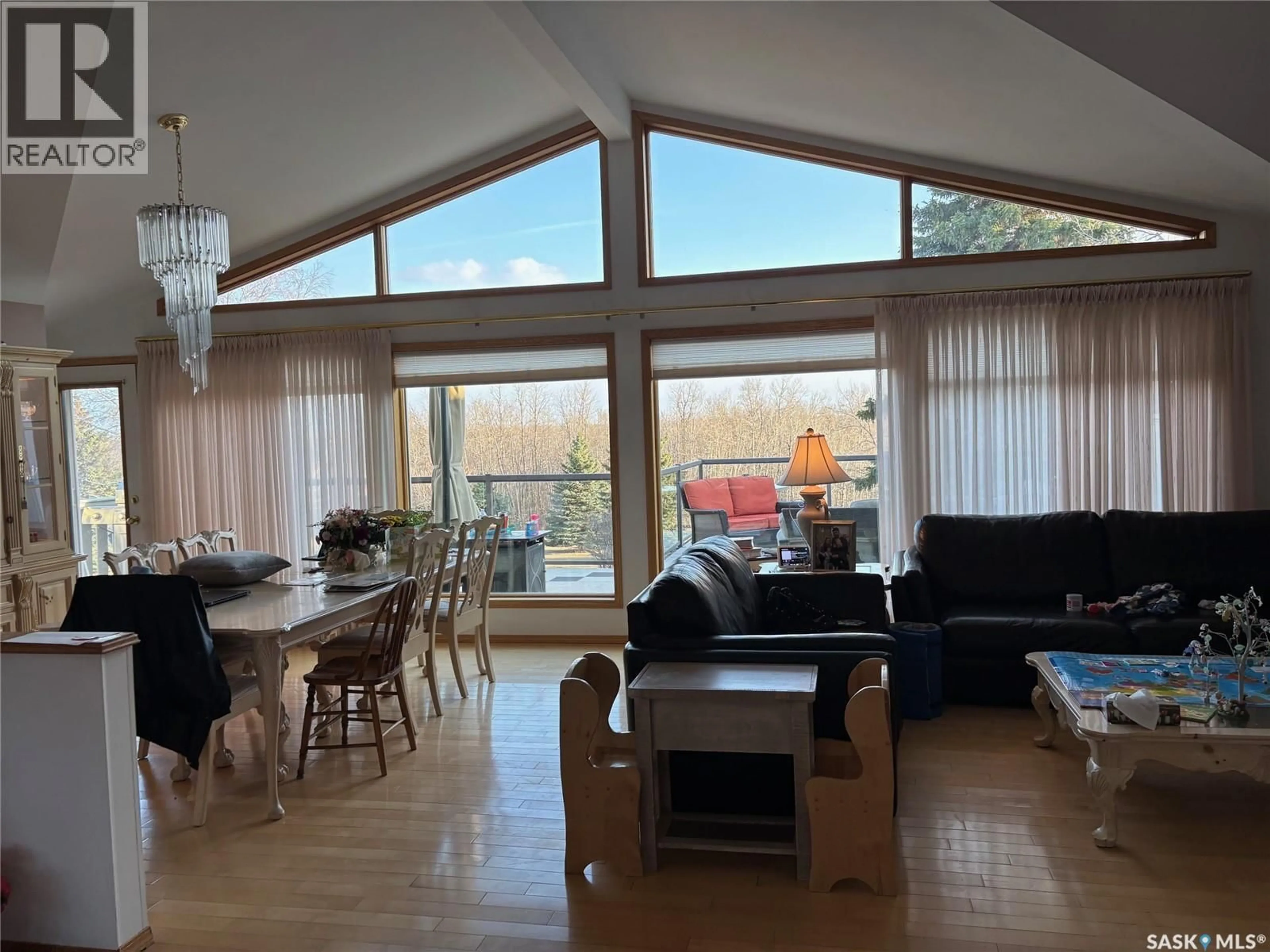 Living room with furniture, wood/laminate floor for 110 LOGAN CRESCENT, Yorkton Saskatchewan S3N0V9