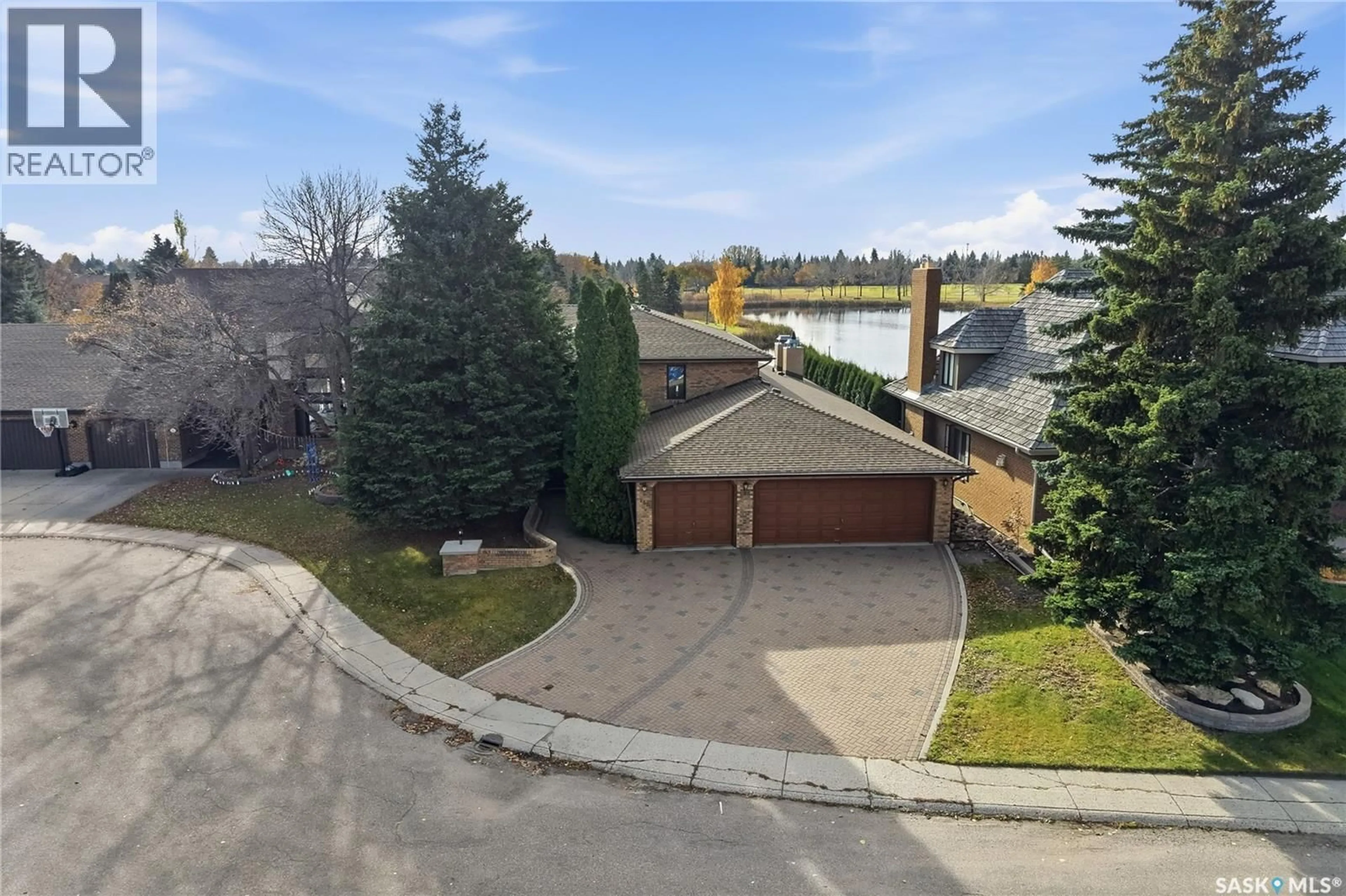 A pic from outside/outdoor area/front of a property/back of a property/a pic from drone, water/lake/river/ocean view for 118 LAKESHORE TERRACE, Saskatoon Saskatchewan S7J3X6
