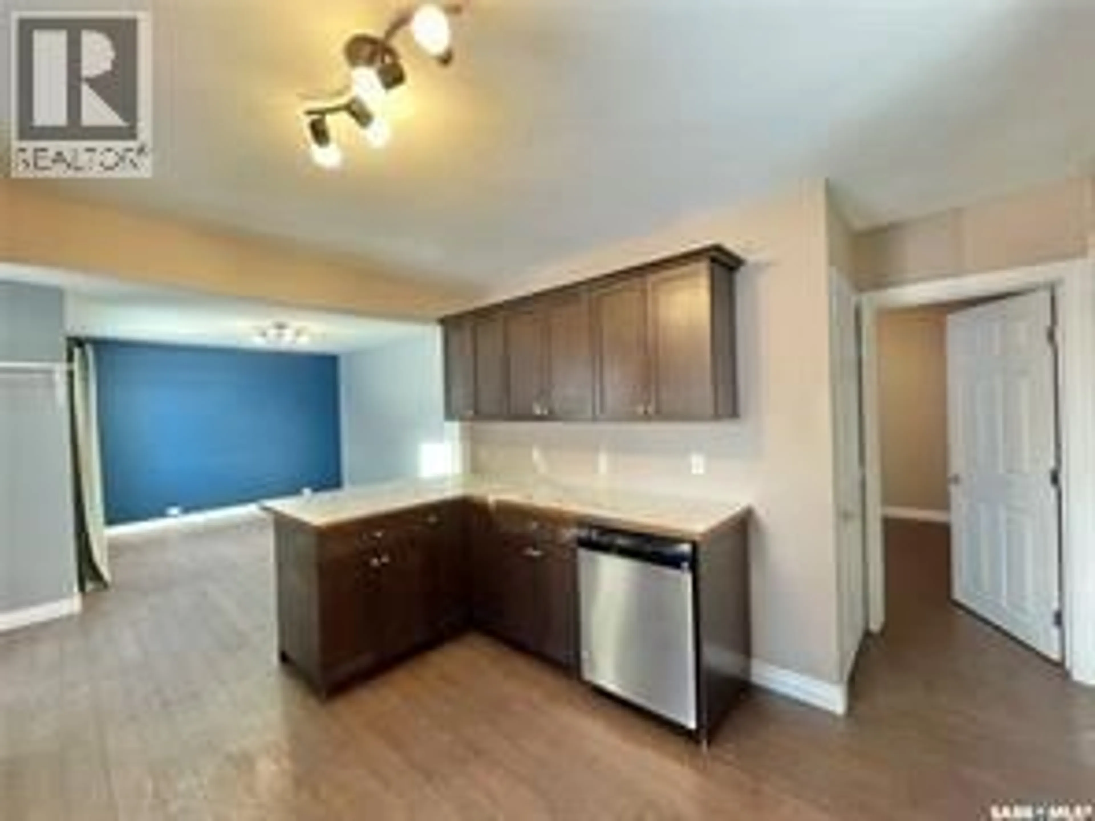 Open concept kitchen, wood/laminate floor for 224 2ND AVENUE, Yorkton Saskatchewan S3N1H9