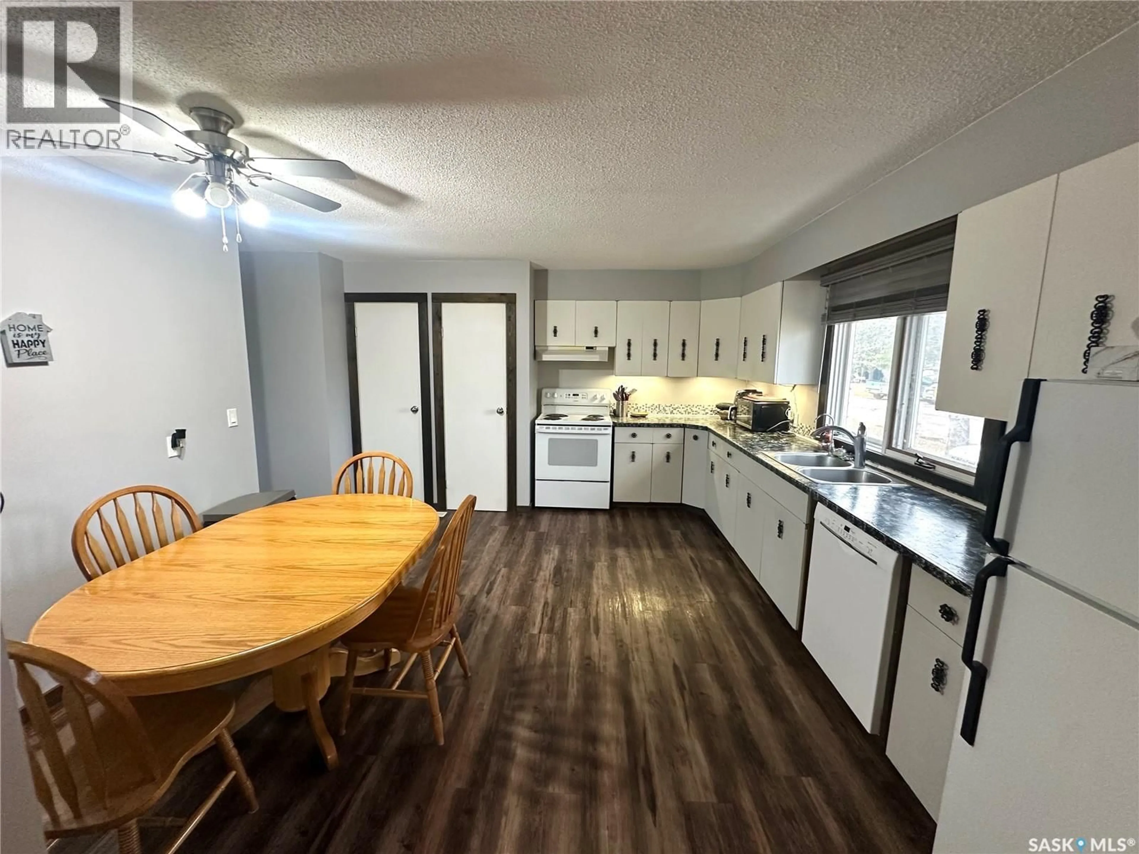 Open concept kitchen, wood/laminate floor for 108 PHILLIPS STREET, Turtleford Saskatchewan S0M2Y0