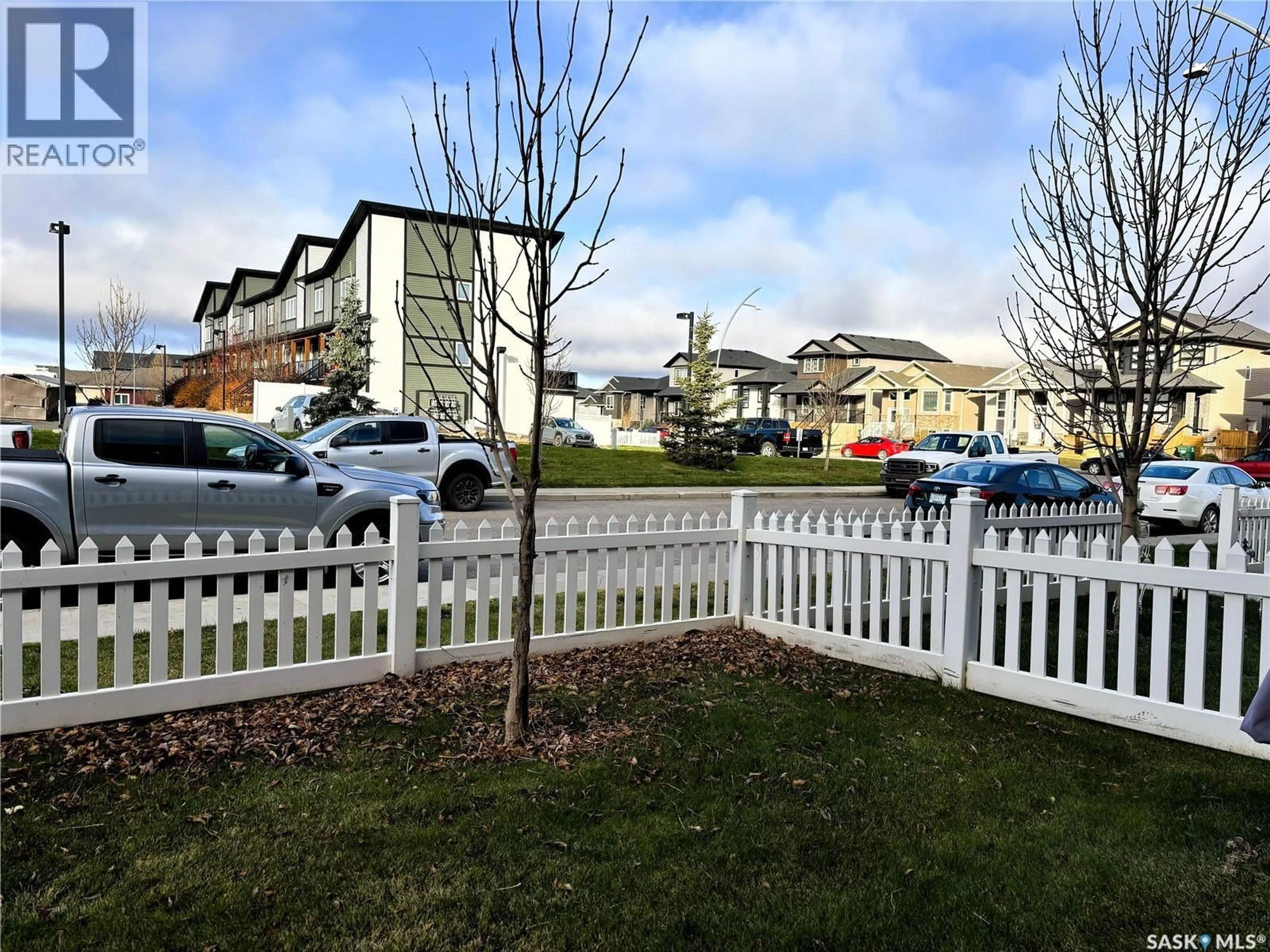 A pic from outside/outdoor area/front of a property/back of a property/a pic from drone, street for 270 250 AKHTAR BEND, Saskatoon Saskatchewan S7W0W4