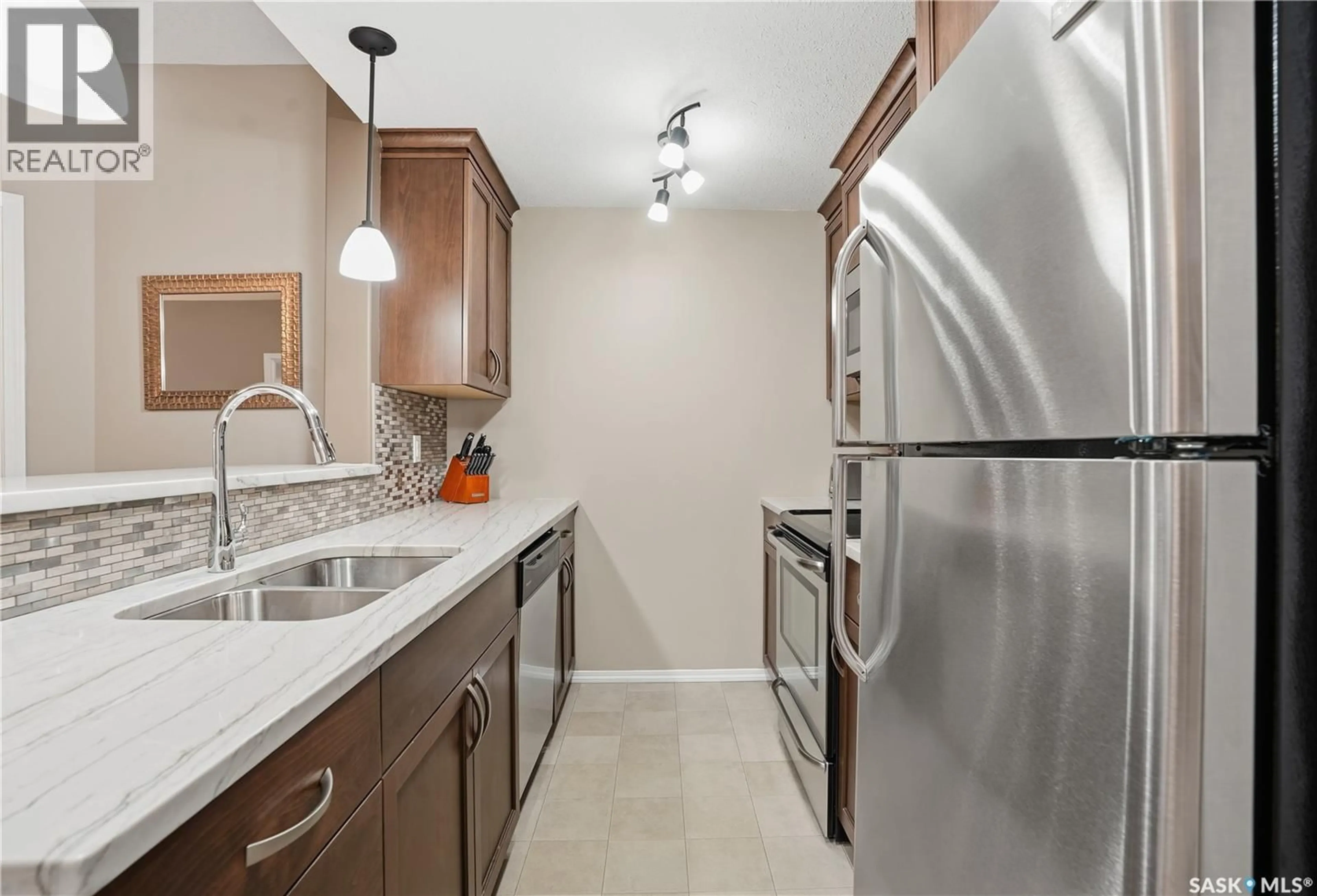 Standard kitchen, ceramic/tile floor for 103 - 1220 BLACKFOOT DRIVE, Regina Saskatchewan S4S6T2