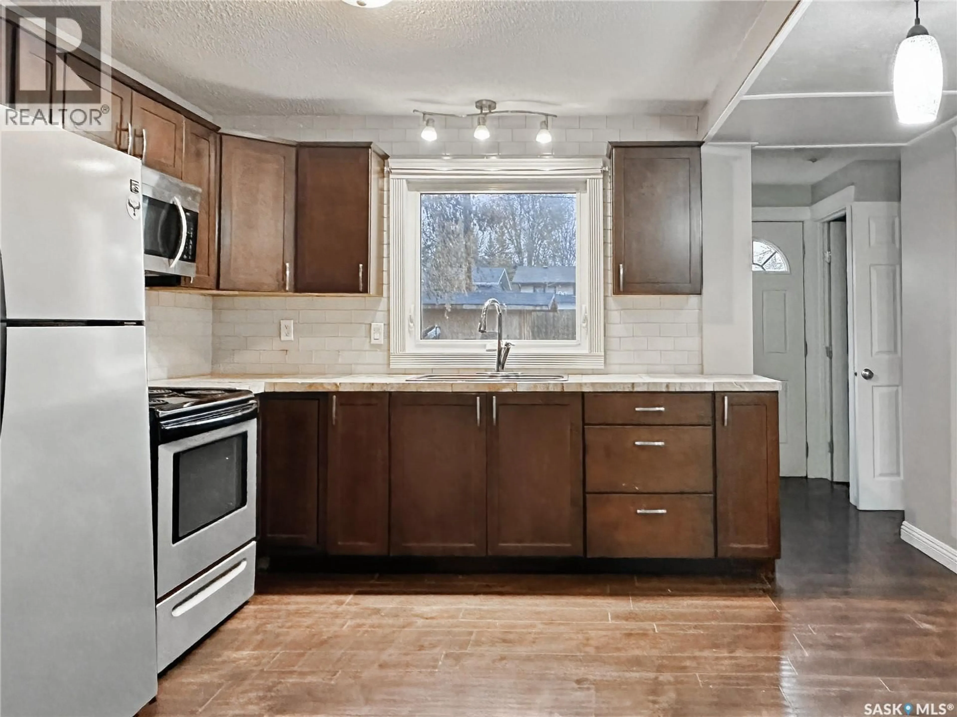 Open concept kitchen, unknown for 1382 94TH STREET, North Battleford Saskatchewan S9A0E2