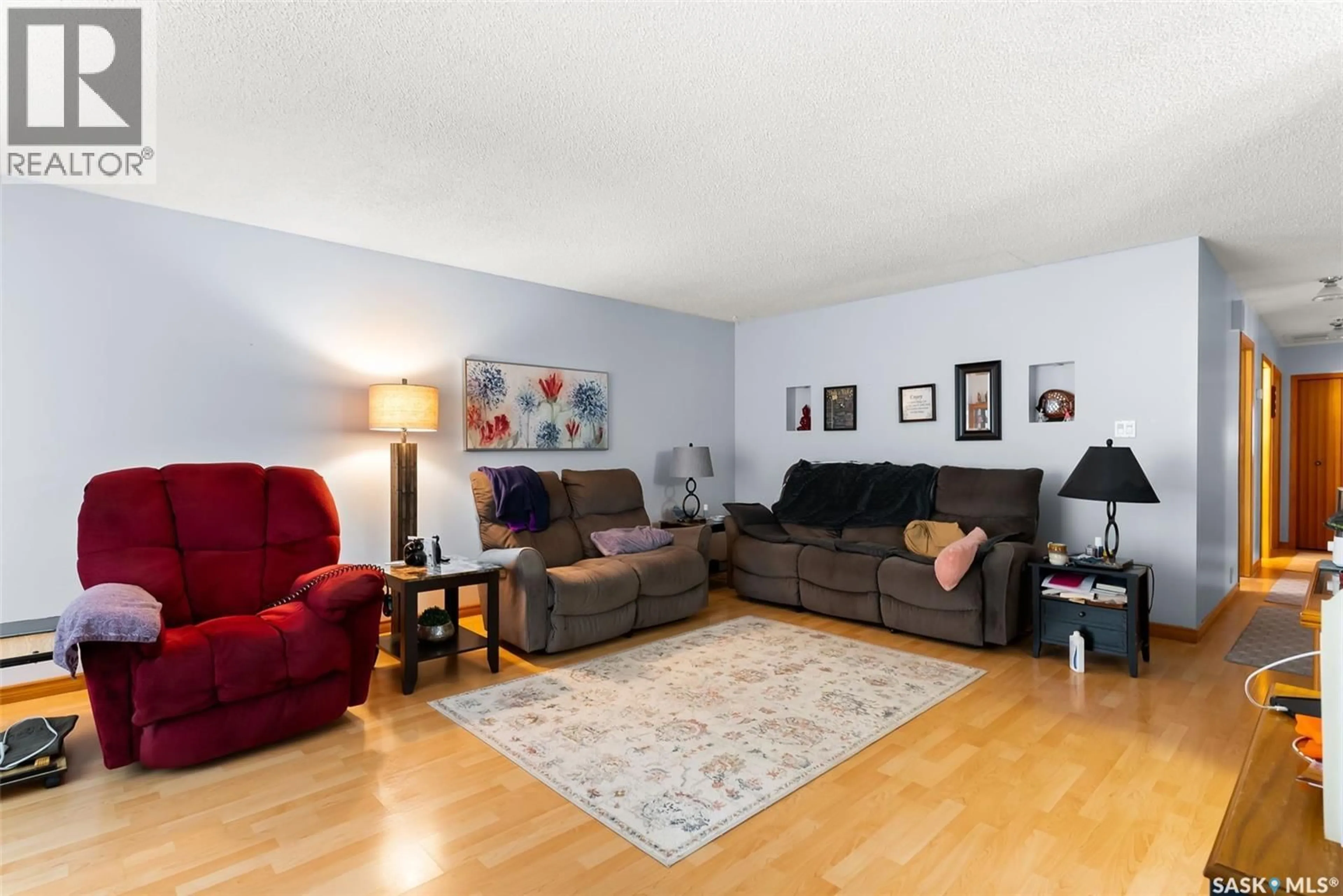 Living room with furniture, wood/laminate floor for 1606 7TH AVENUE, Regina Saskatchewan S4N5S6