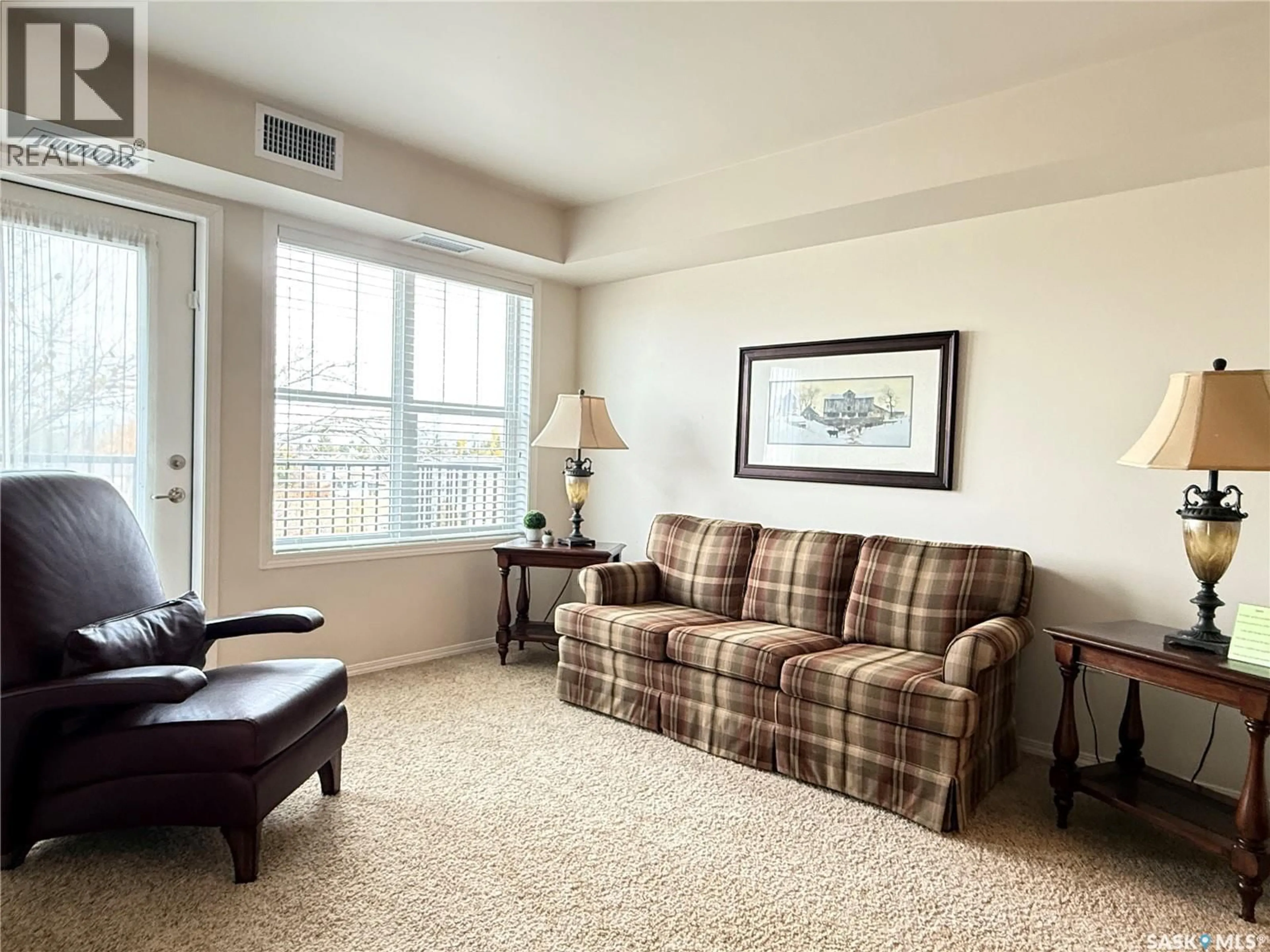 Living room with furniture, carpet floor for E - 222 680 7TH AVENUE, Melville Saskatchewan S0A2P1