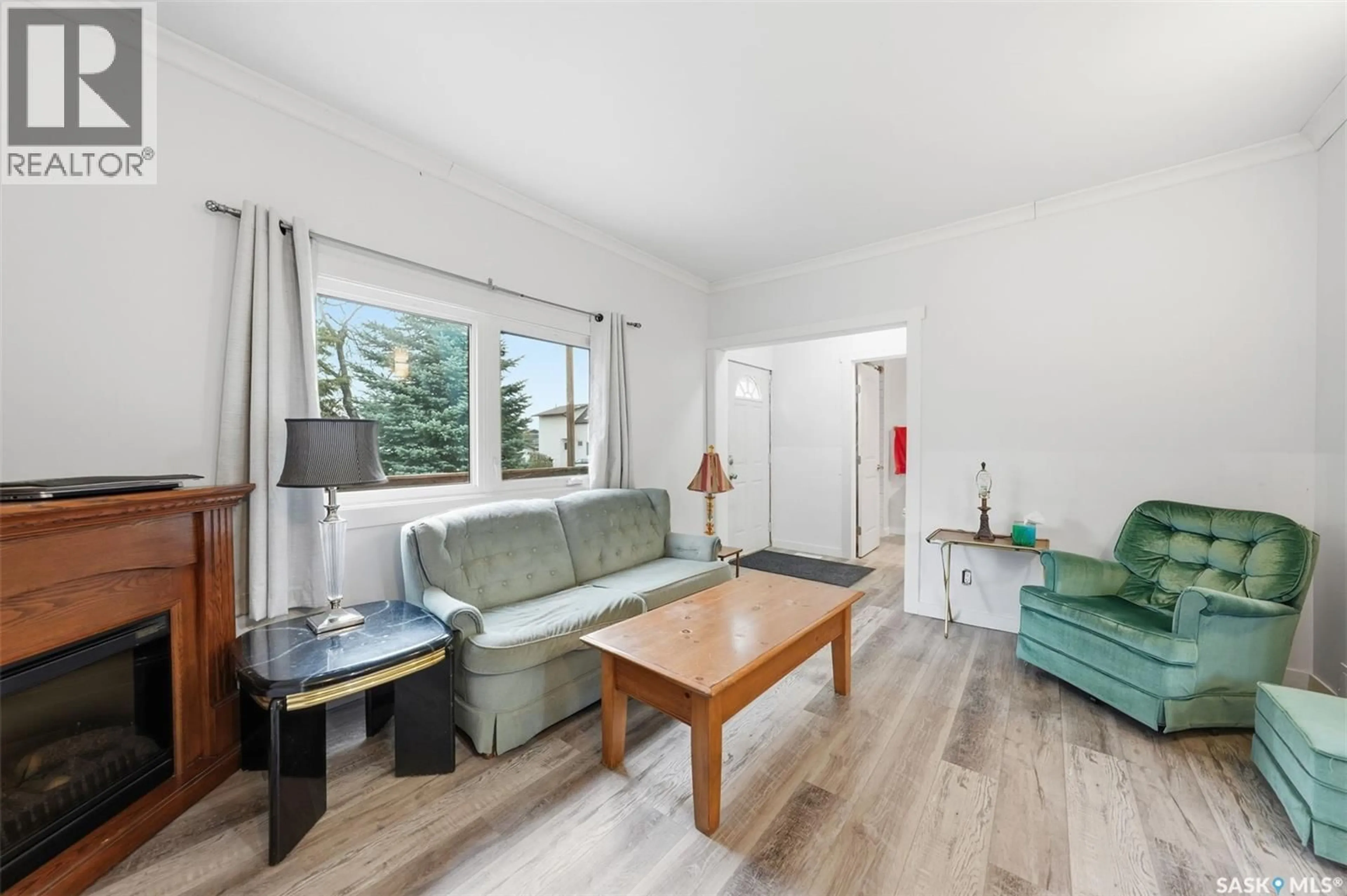 Living room with furniture, wood/laminate floor for 455 ANDREW STREET, Asquith Saskatchewan S0K0J0