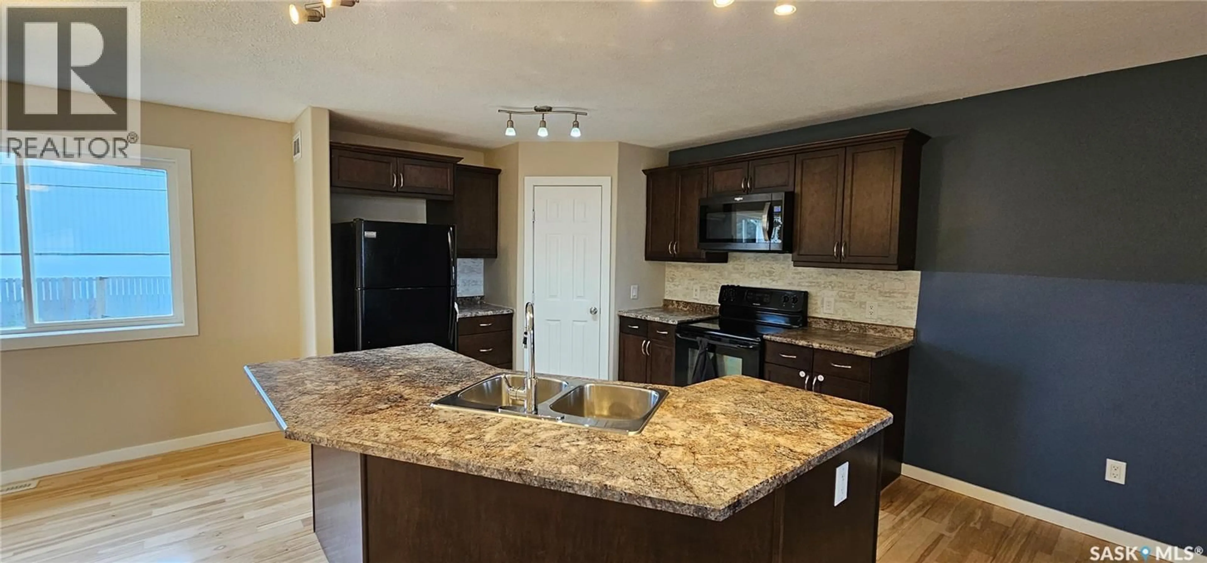 Open concept kitchen, ceramic/tile floor for 317 BURROWS AVENUE, Melfort Saskatchewan S0E1A0