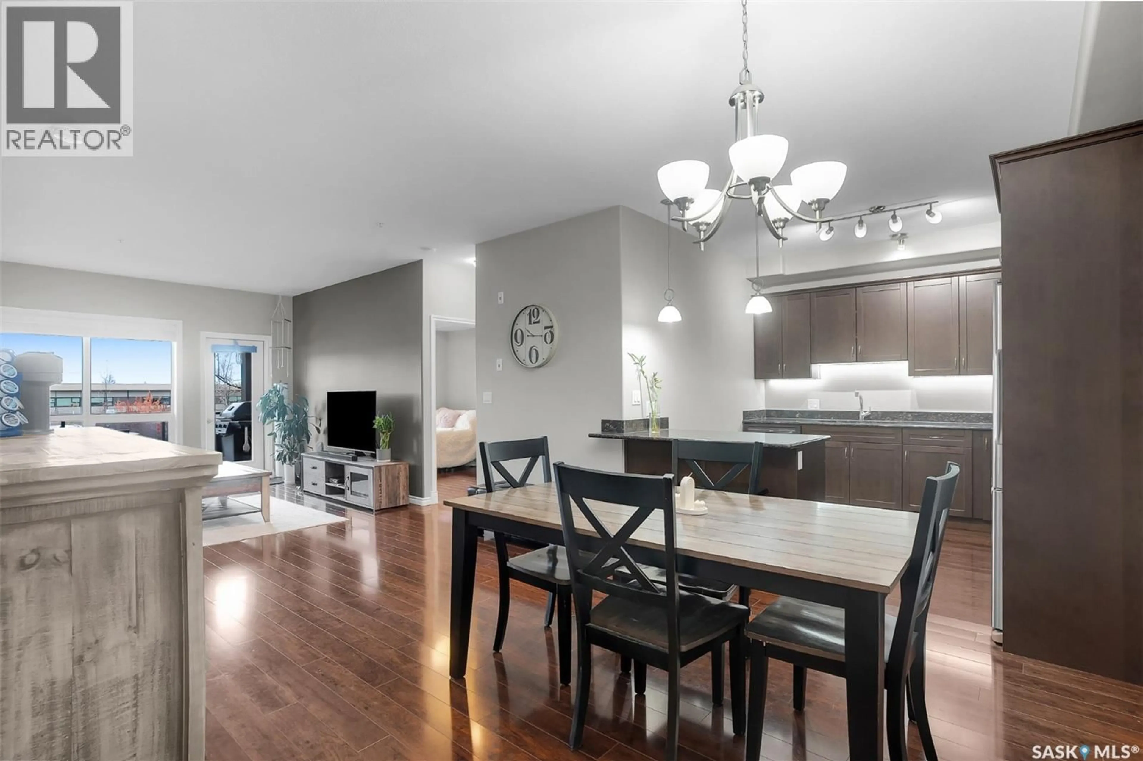 Open concept kitchen, wood/laminate floor for 125 - 2710 MAIN STREET, Saskatoon Saskatchewan S7M0M3