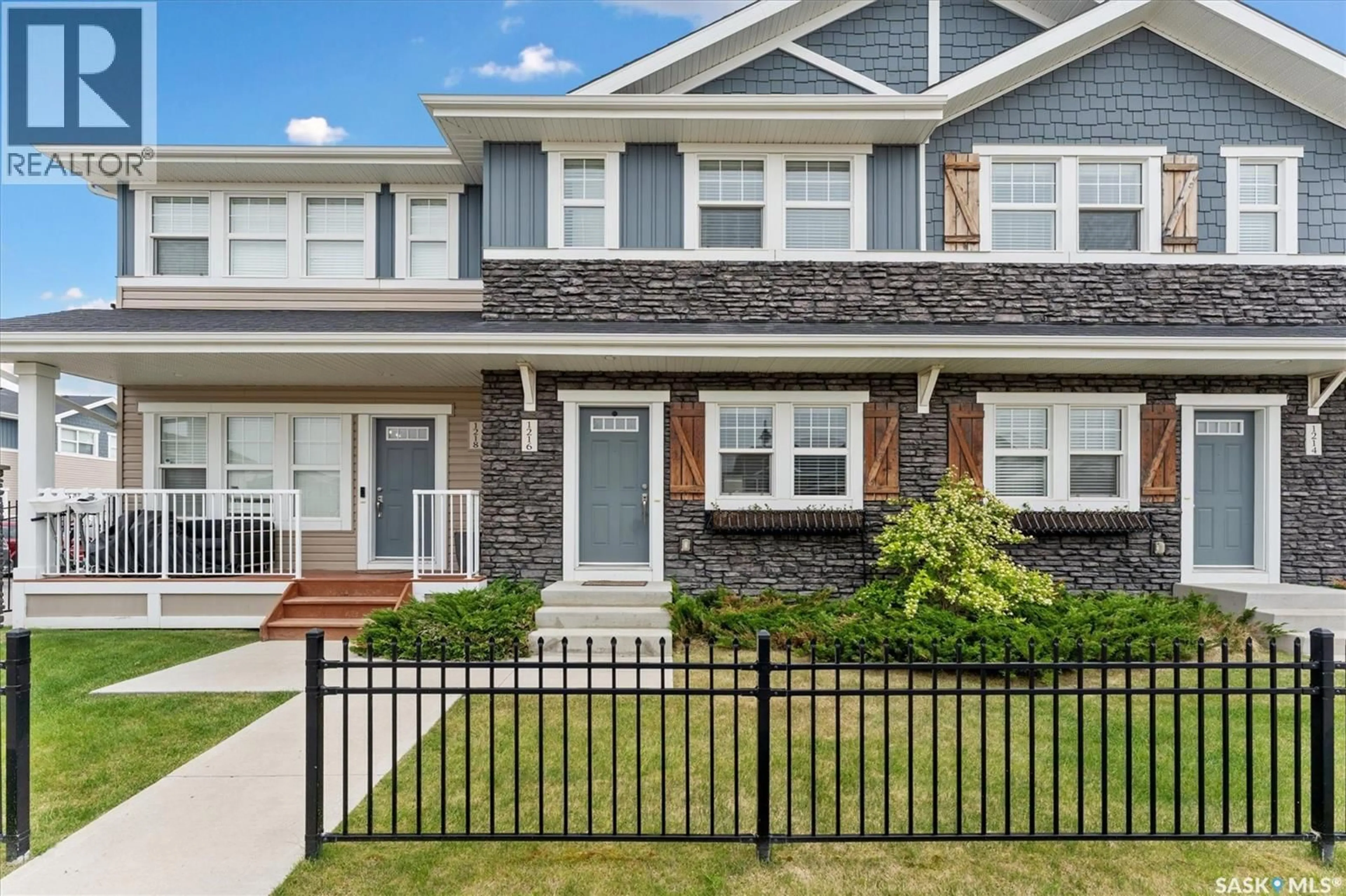 Home with vinyl exterior material, street for 1216 PRINGLE WAY, Saskatoon Saskatchewan S7T0X5