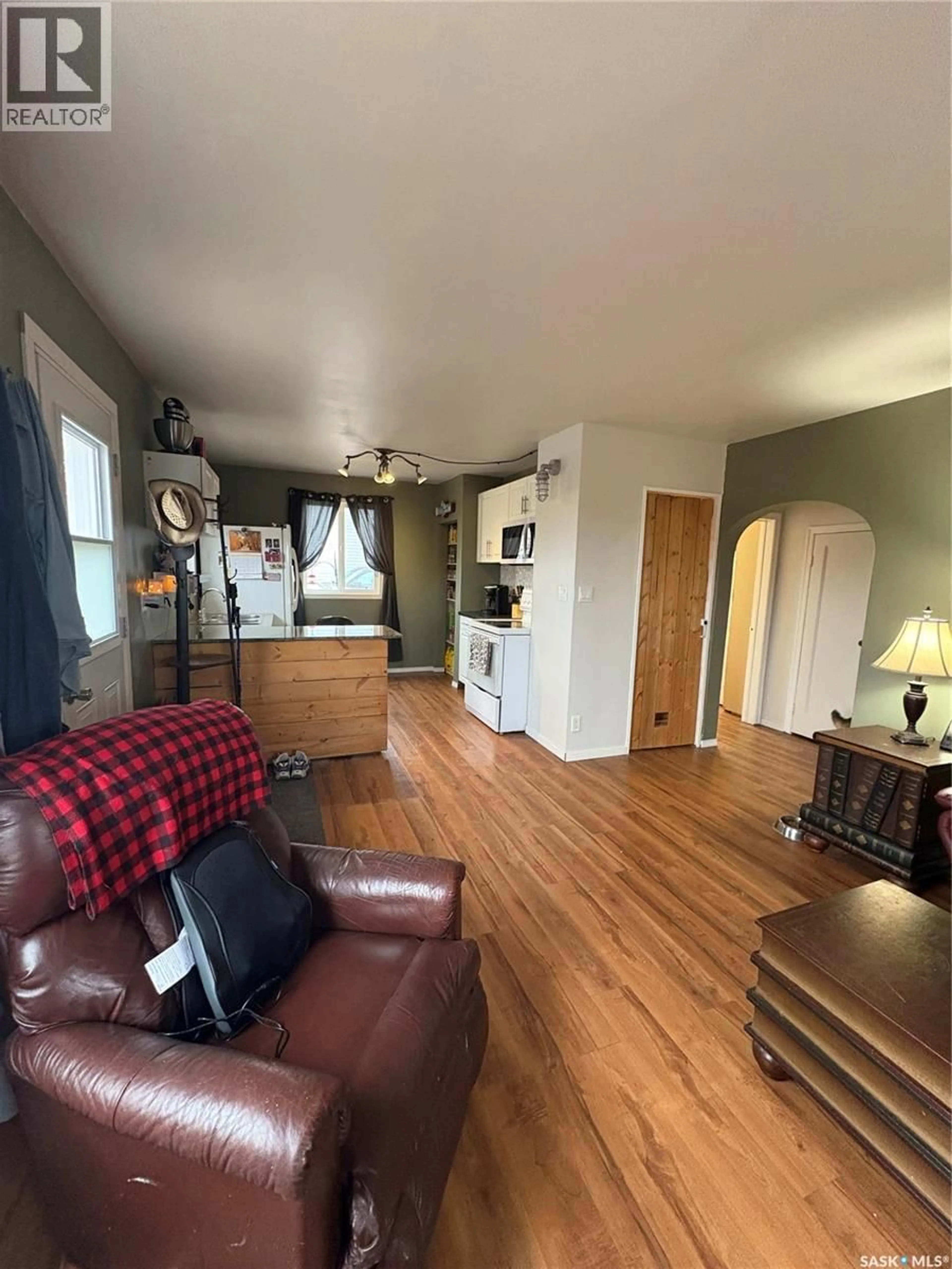 Living room with furniture, wood/laminate floor for 114 MCINTOSH STREET, Markinch Saskatchewan S0G3J0