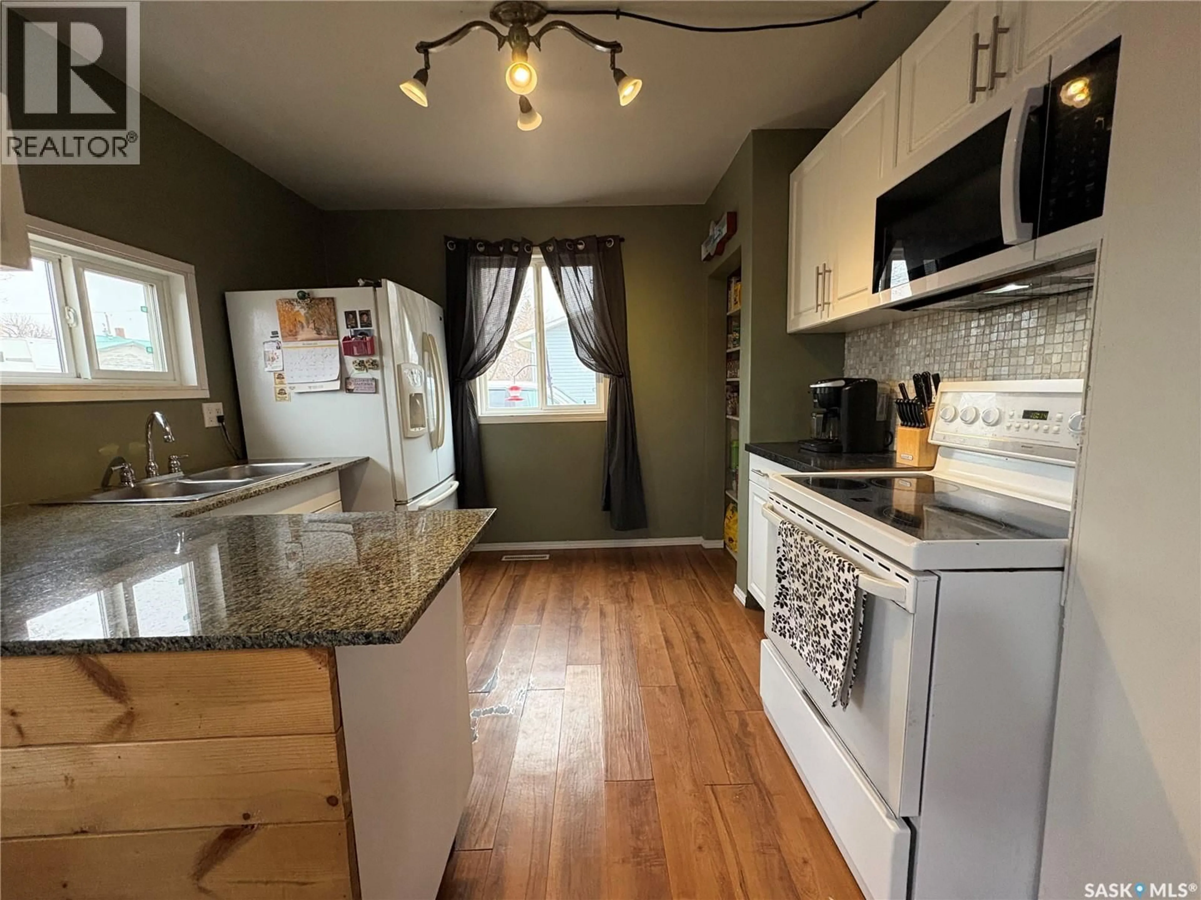 Standard kitchen, wood/laminate floor for 114 MCINTOSH STREET, Markinch Saskatchewan S0G3J0