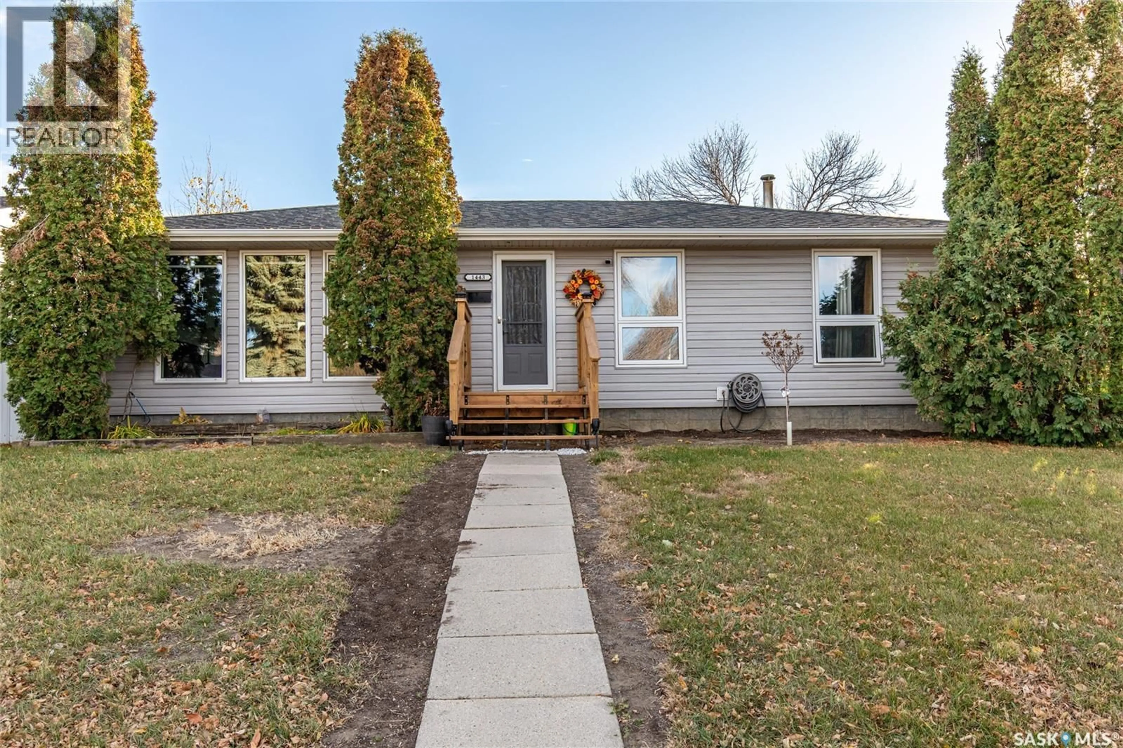 Home with vinyl exterior material, street for 1443 SMITH STREET, Moose Jaw Saskatchewan S6H6W6