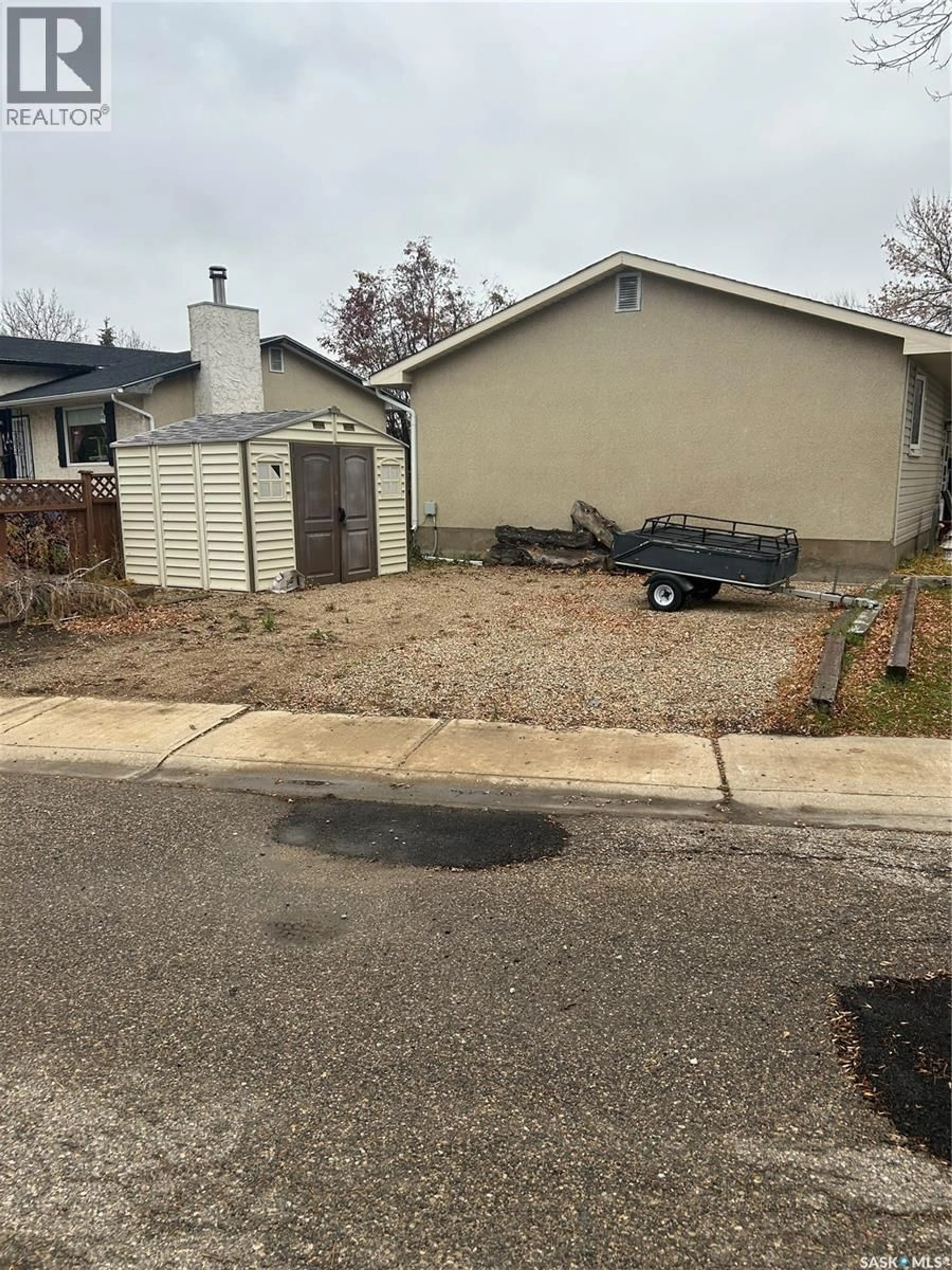 A pic from outside/outdoor area/front of a property/back of a property/a pic from drone, street for 28 CARMICHAEL ROAD, Regina Saskatchewan S4R0C5