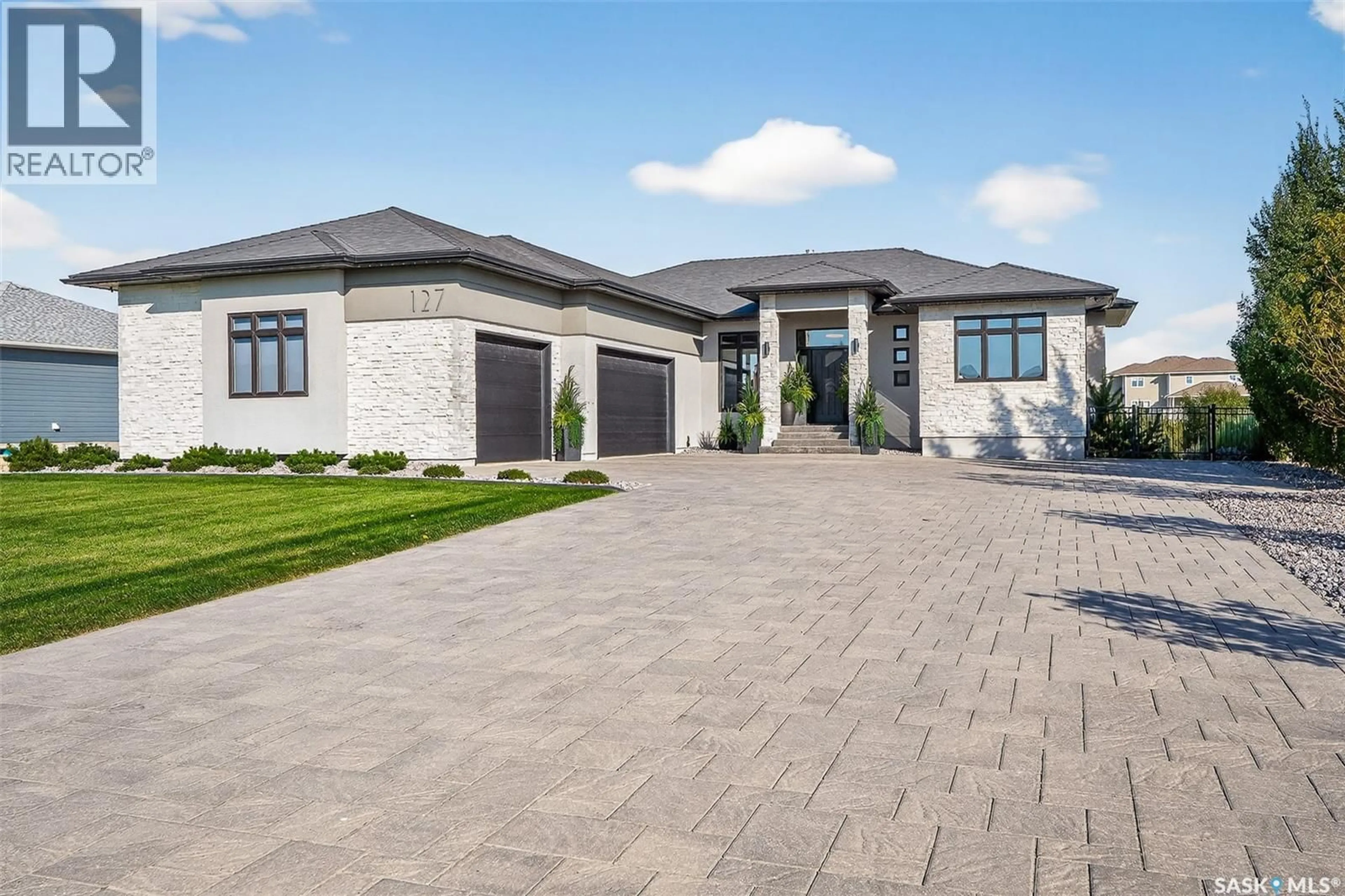 Home with brick exterior material, street for 127 IRON BRIDGE DRIVE, Moose Jaw Saskatchewan S6J0B4