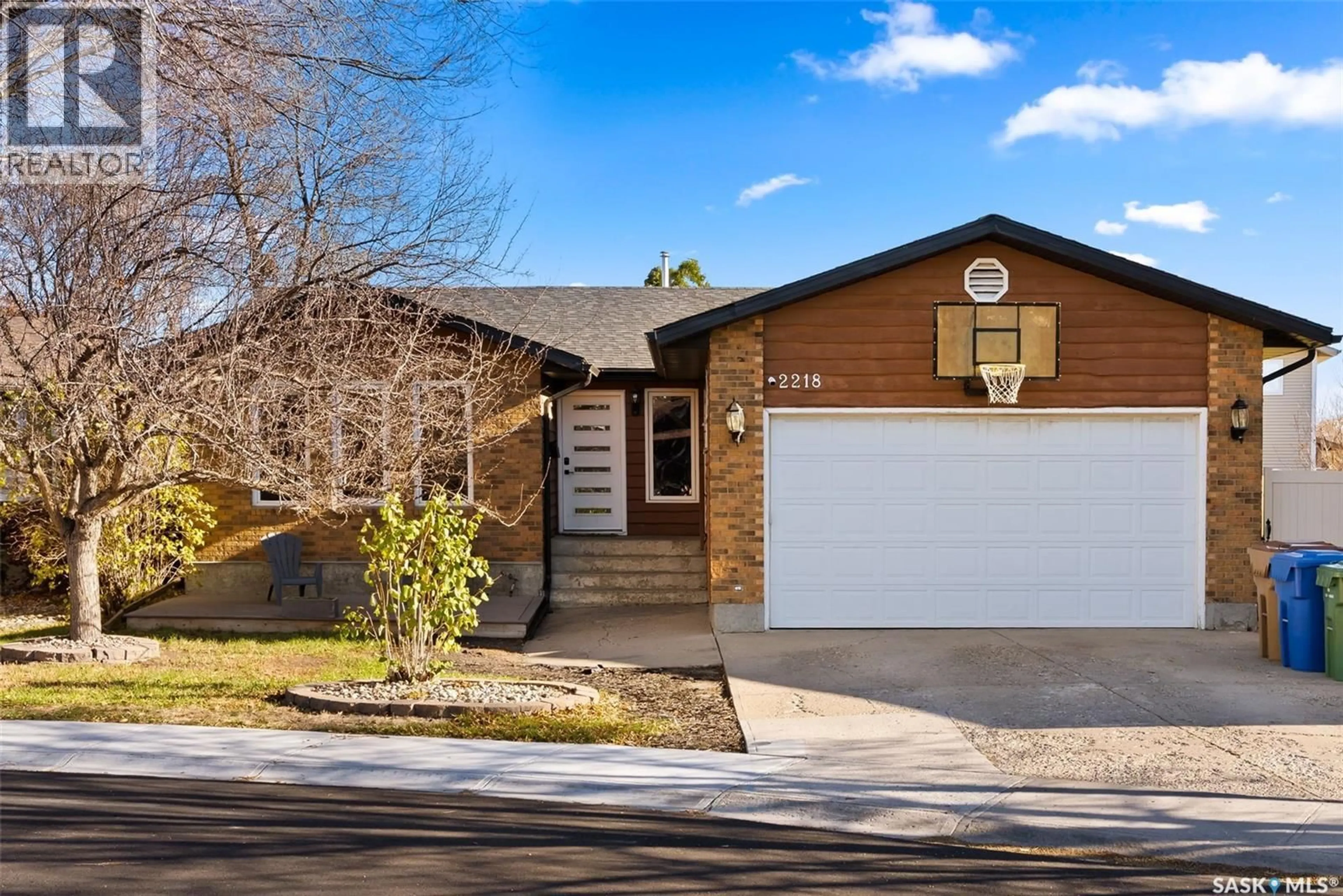 Home with brick exterior material, street for 2218 BALDWIN BAY, Regina Saskatchewan S4V1H2