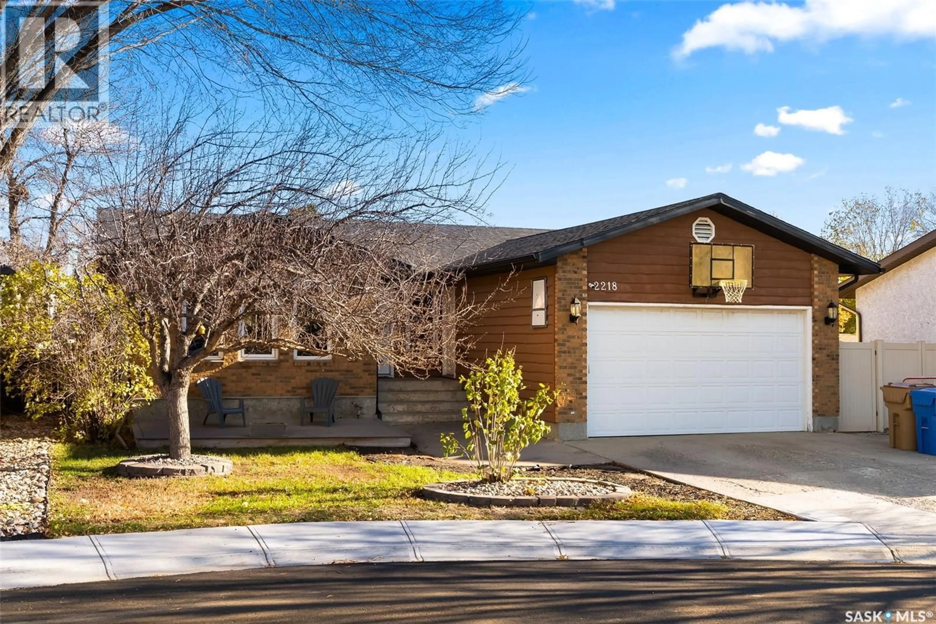 Home with brick exterior material, street for 2218 BALDWIN BAY, Regina Saskatchewan S4V1H2