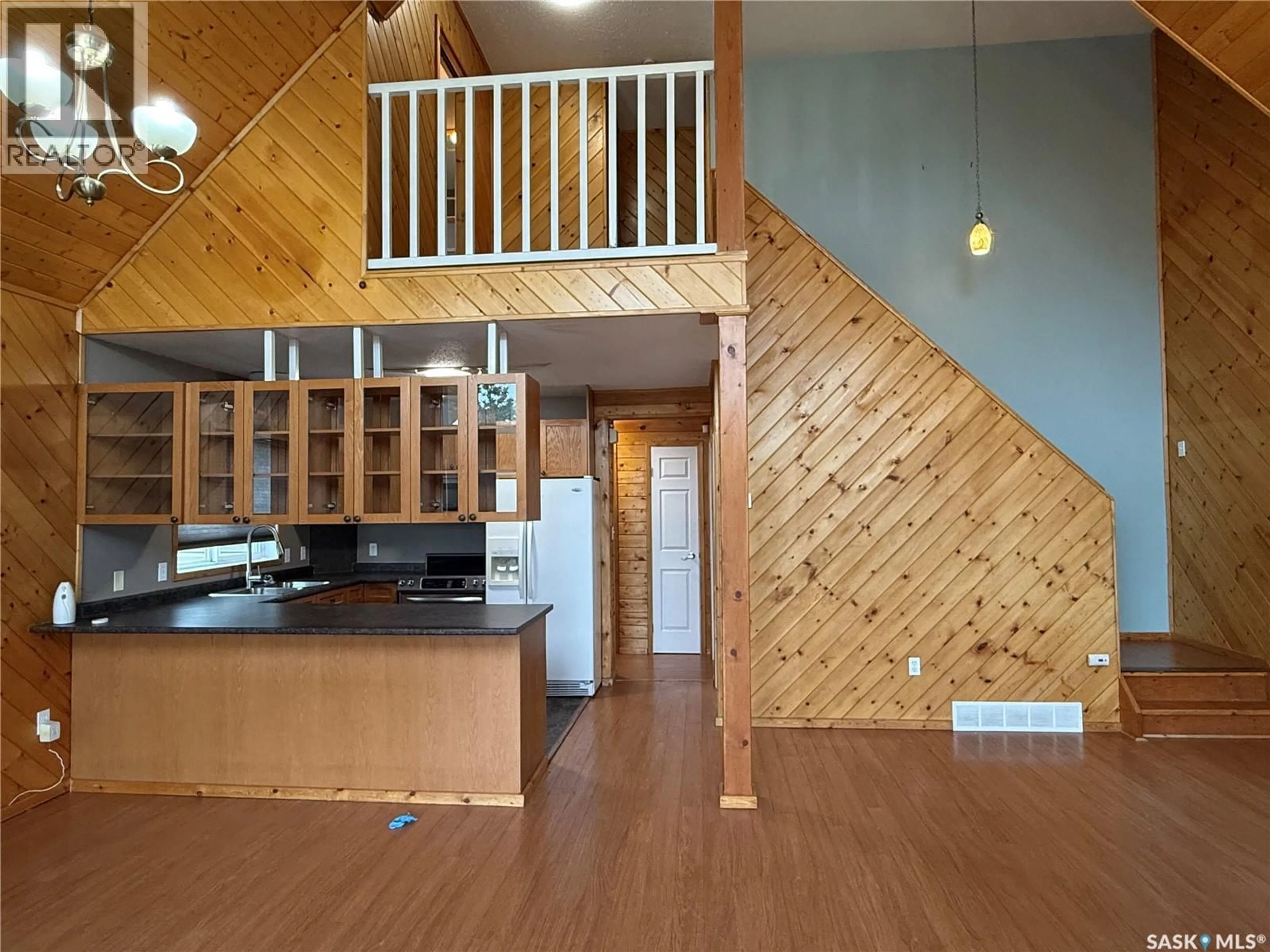 Open concept kitchen, wood/laminate floor for 231 KIEZIE CHANNEL DRIVE, Buffalo Narrows Saskatchewan S0M0J0