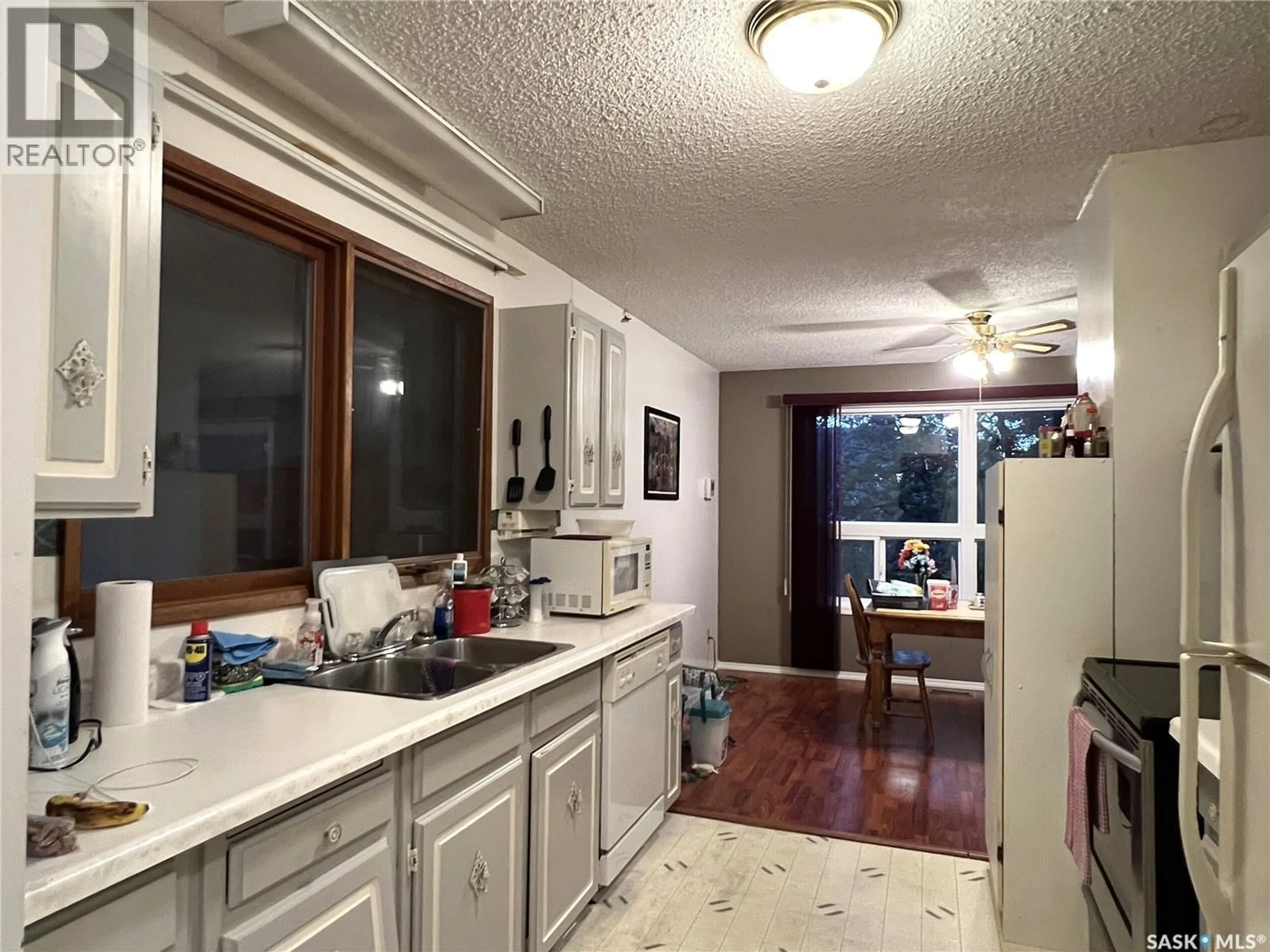 Kitchen with laundary machines, ceramic/tile floor for 904 RAILWAY AVENUE, Loon Lake Saskatchewan S0M1L0