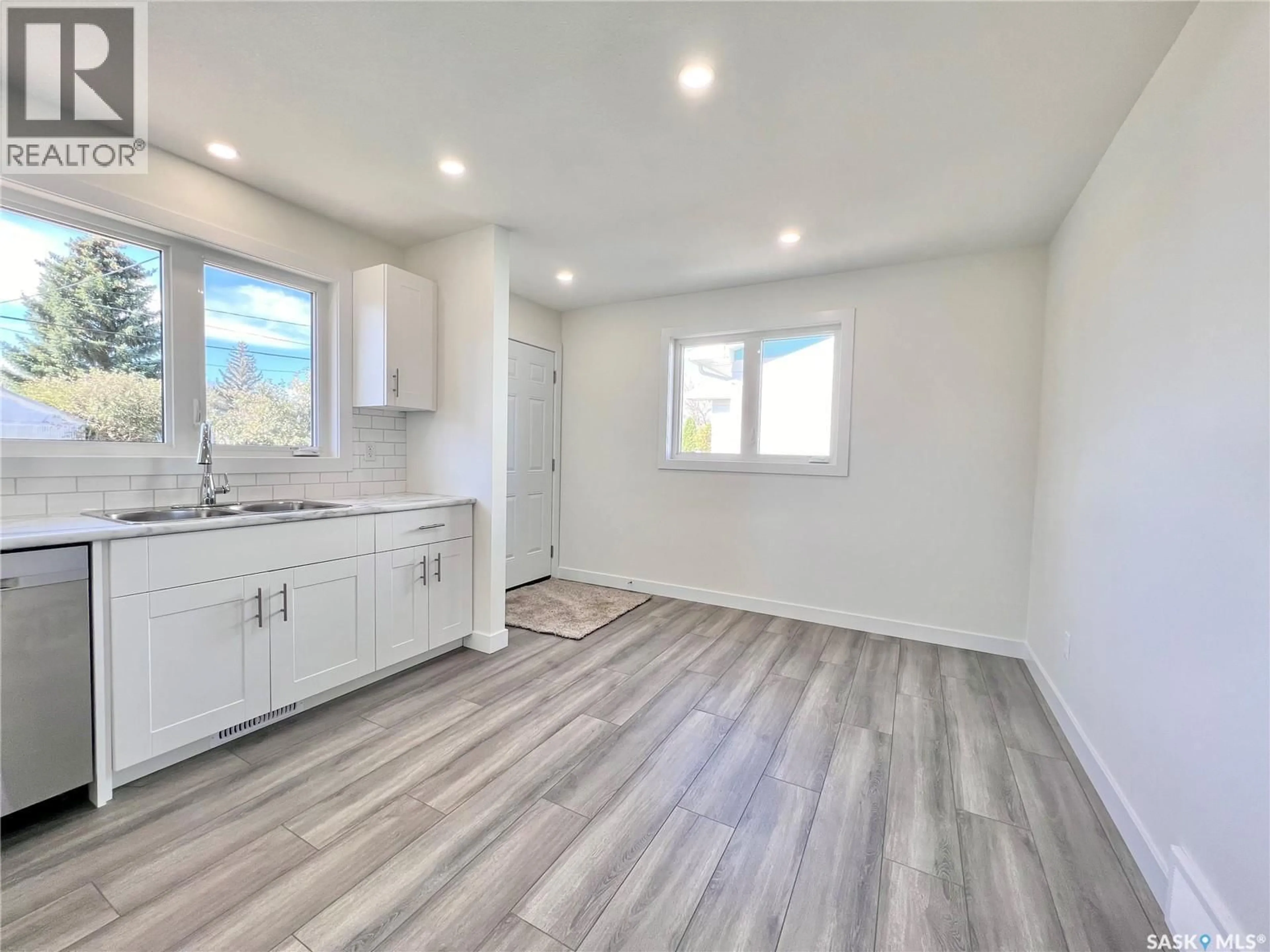Open concept kitchen, wood/laminate floor for 318 MCTAVISH STREET, Outlook Saskatchewan S0L2N0